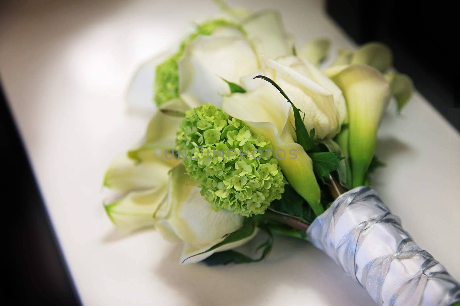 A wedding bouquet with white flowers.