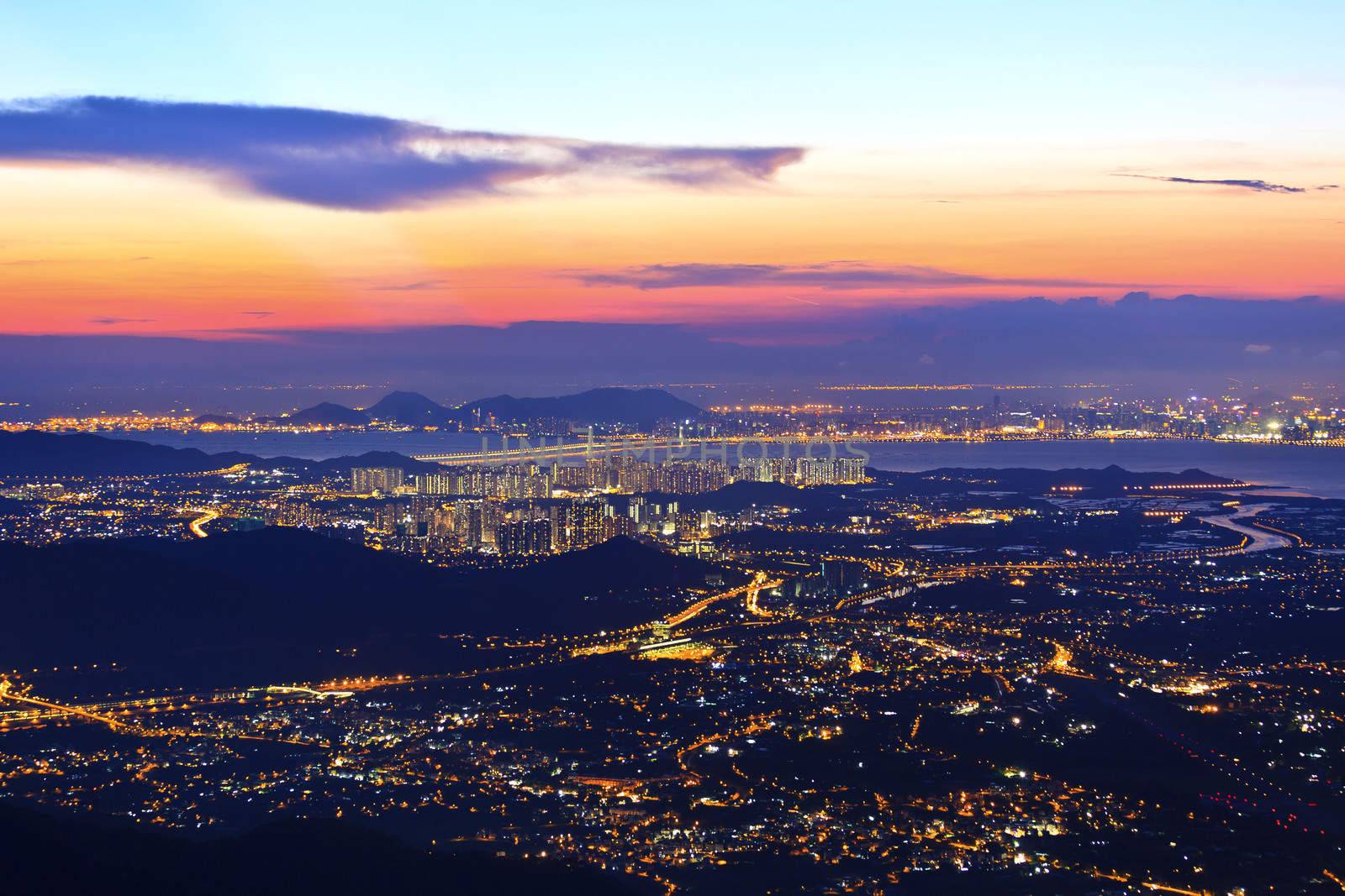 Sunset in Hong Kong plain area over mountains