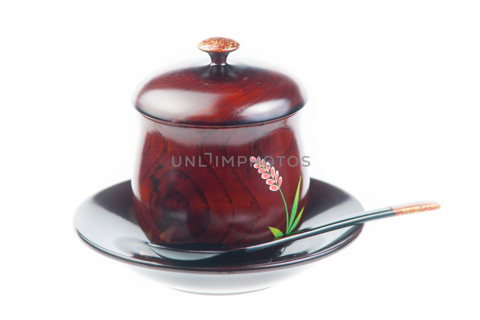 Traditoinal teacup, dish and spoon on white background