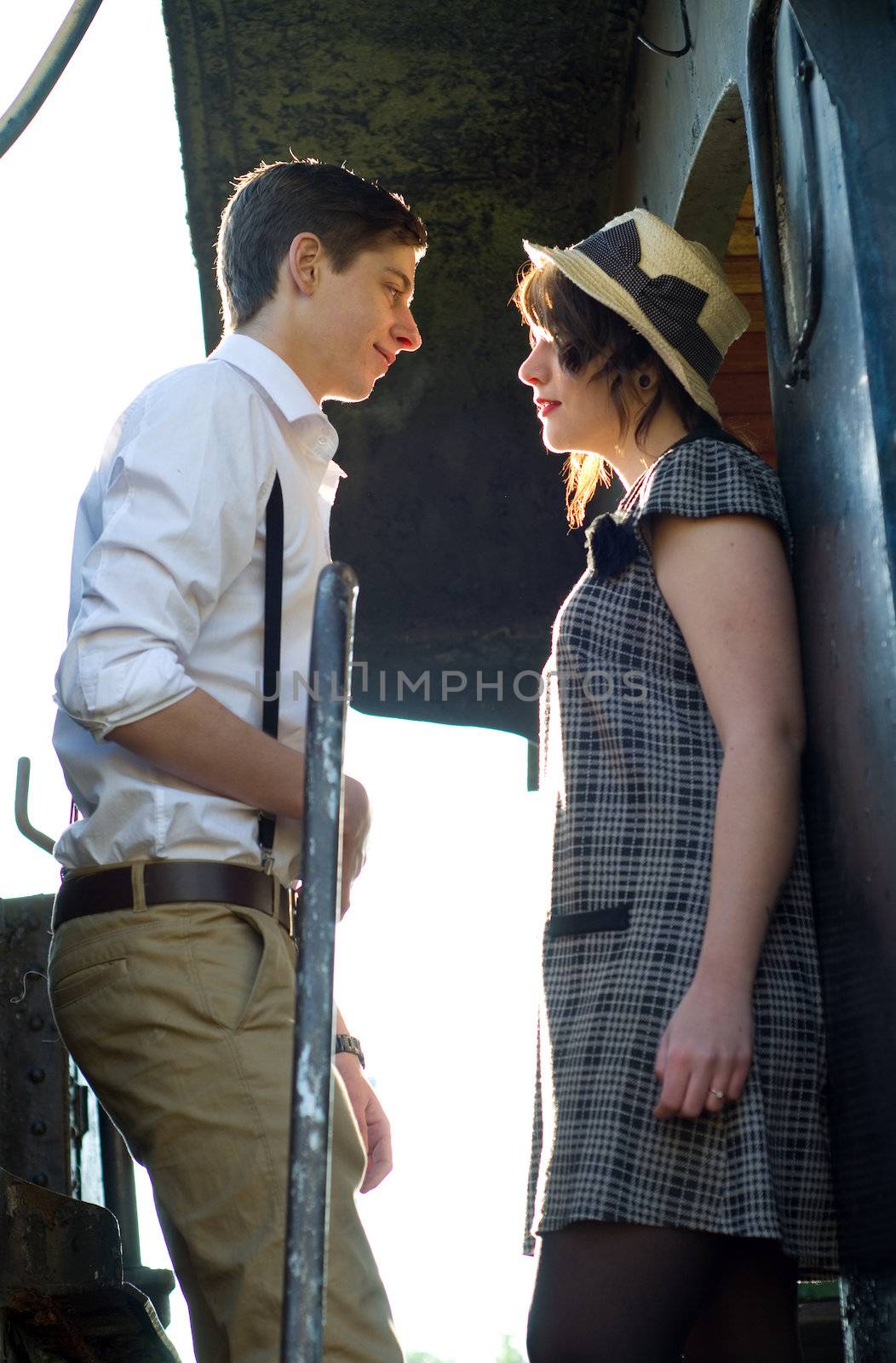 Retro hip hipster romantic love couple in vintage train setting