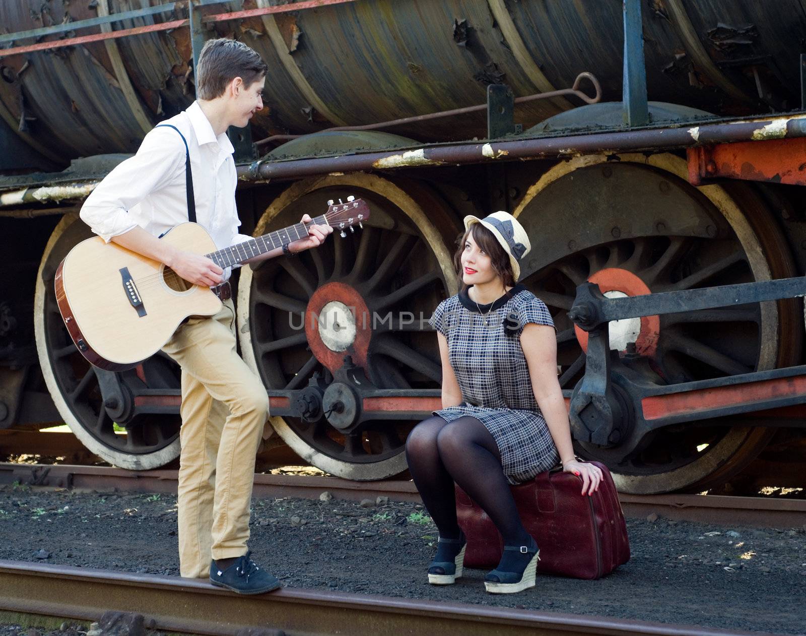 Retro hip hipster romantic love couple serenade  vintage train setting