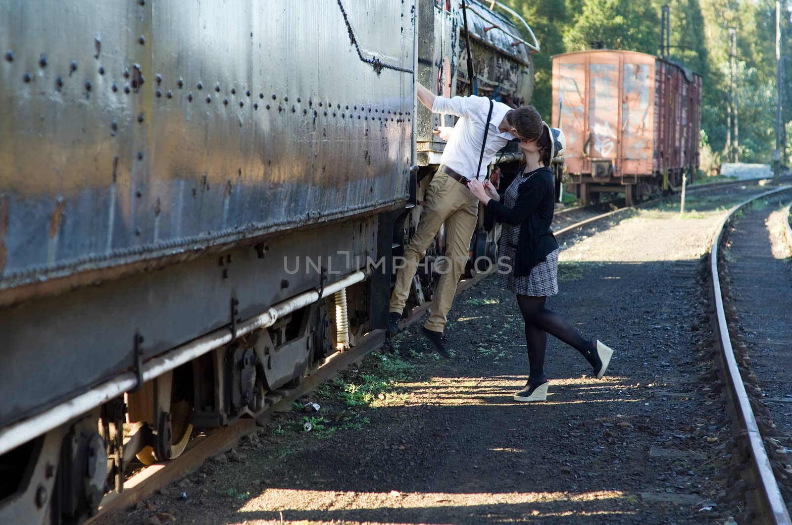 Retro hip hipster romantic love couple in vintage train setting