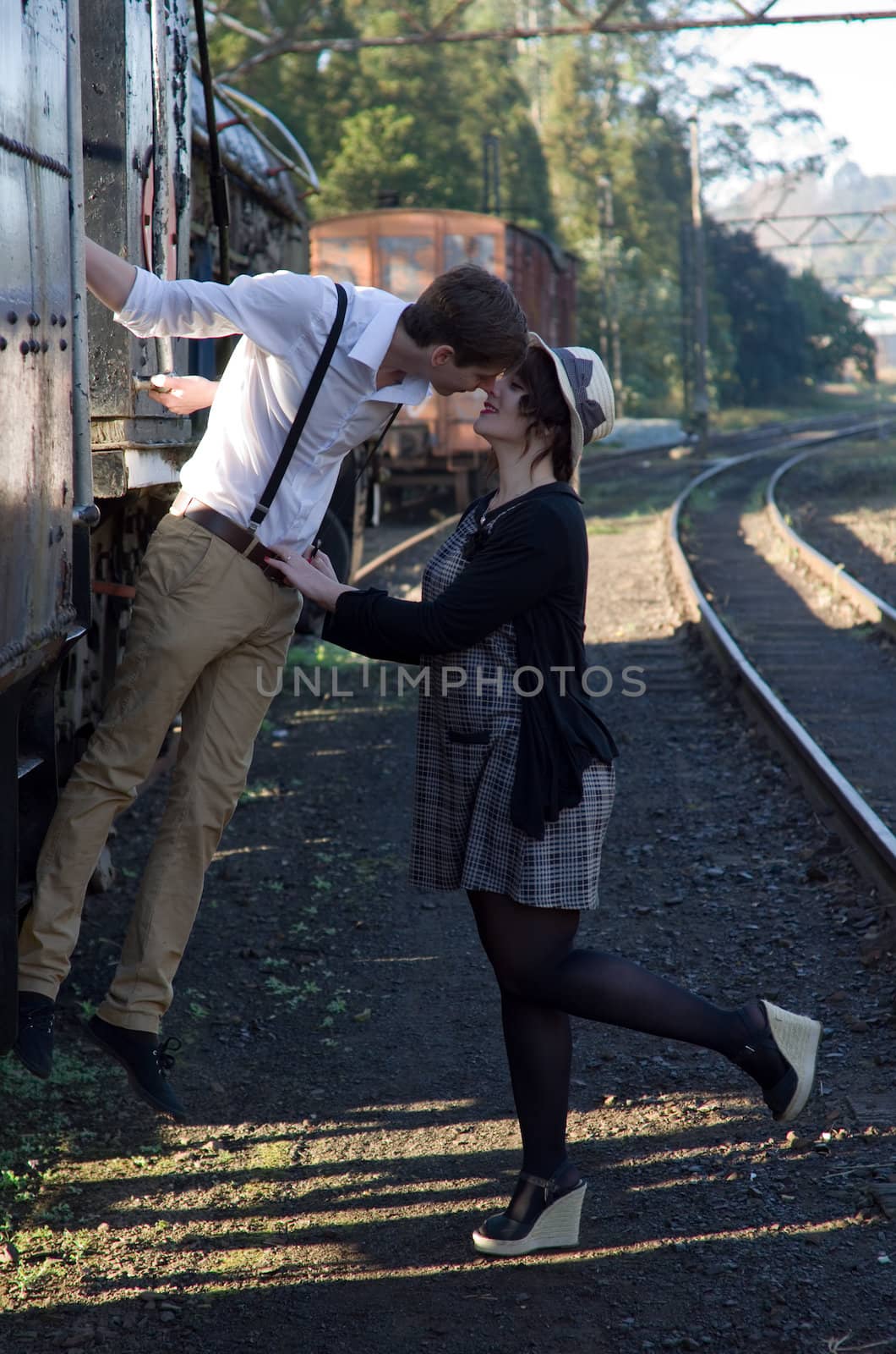 Retro young love couple vintage train setting by alistaircotton