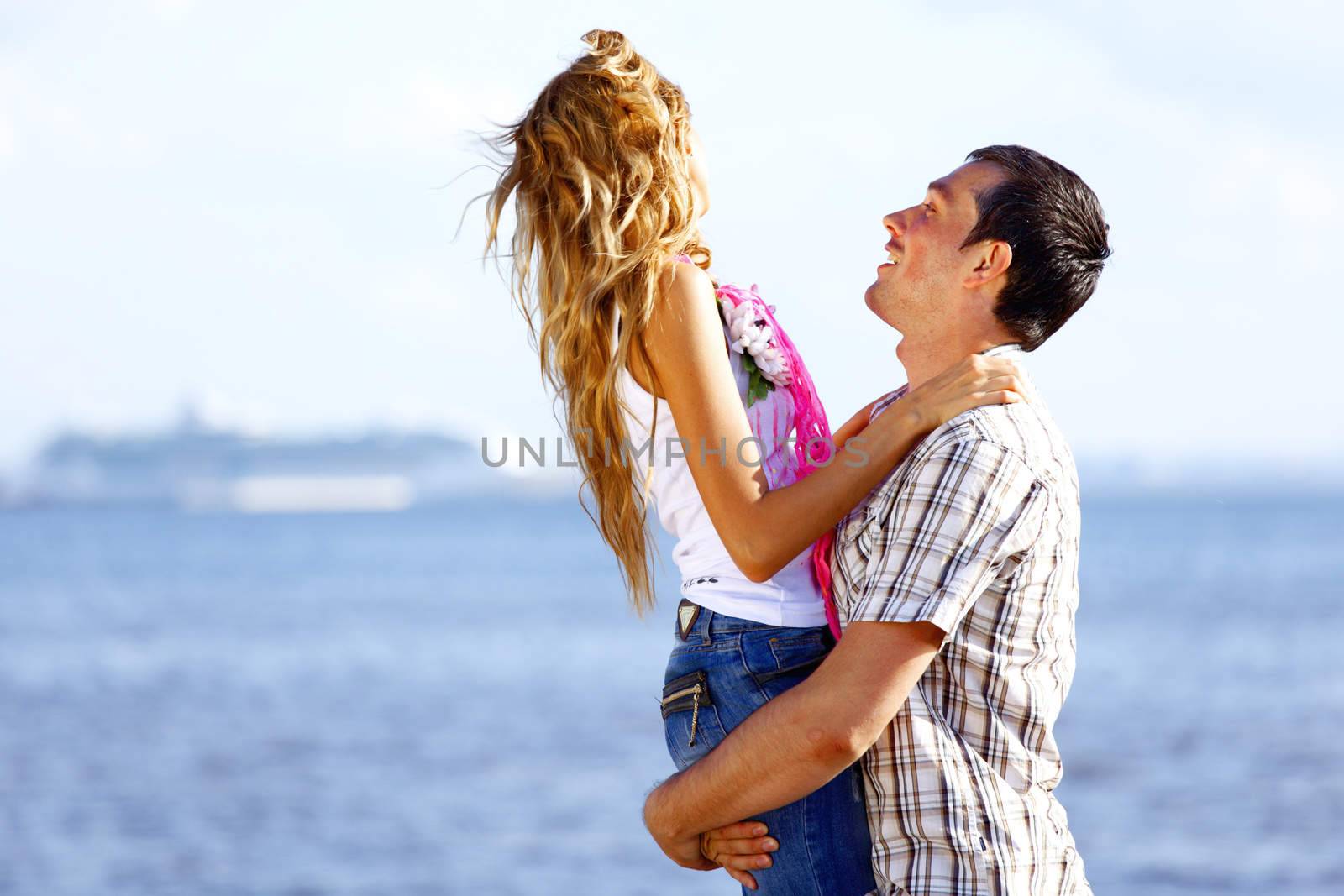 man and woman hug in the sky and sea on sea