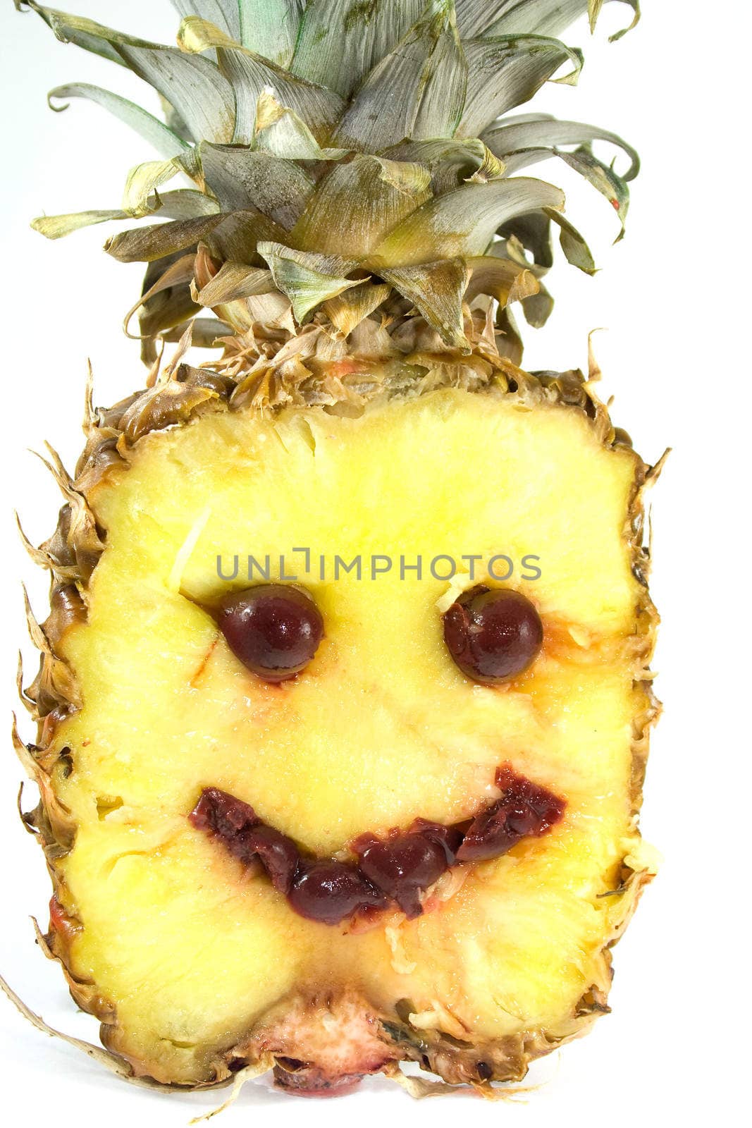 Smiling pineapple with cherry