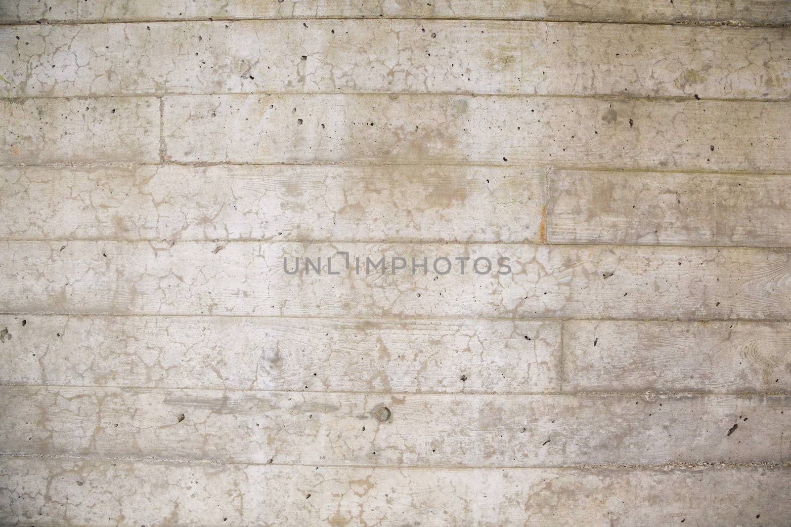 A cement wall is photographed with a wide angle lens to create this background texture image of the concrete.
