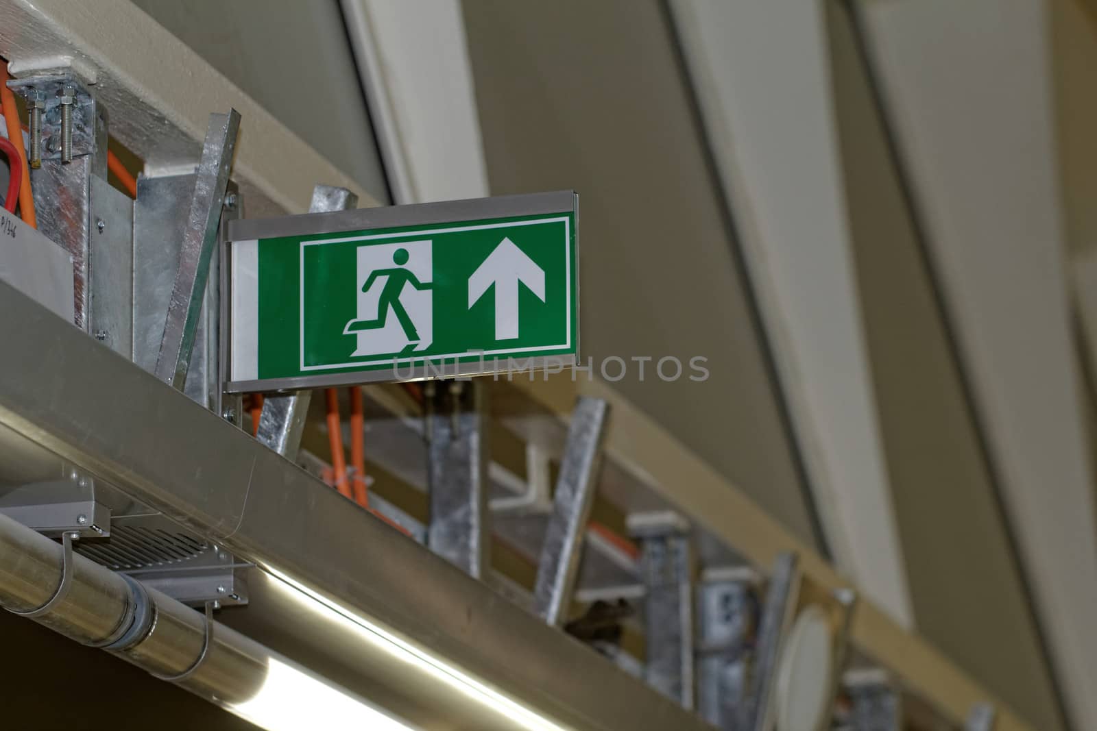 Emergency exit sign in construction site an industrial plant