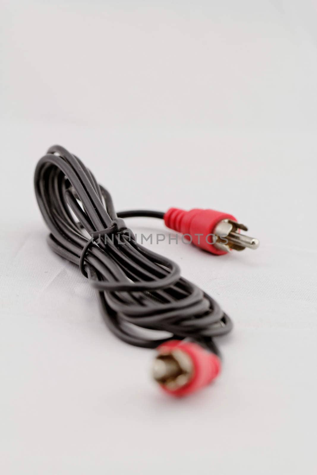 only red audio RCA cable on a white background (left)