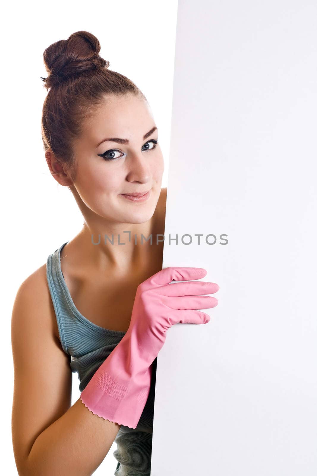 Cleaning woman showing a white paper on the white background