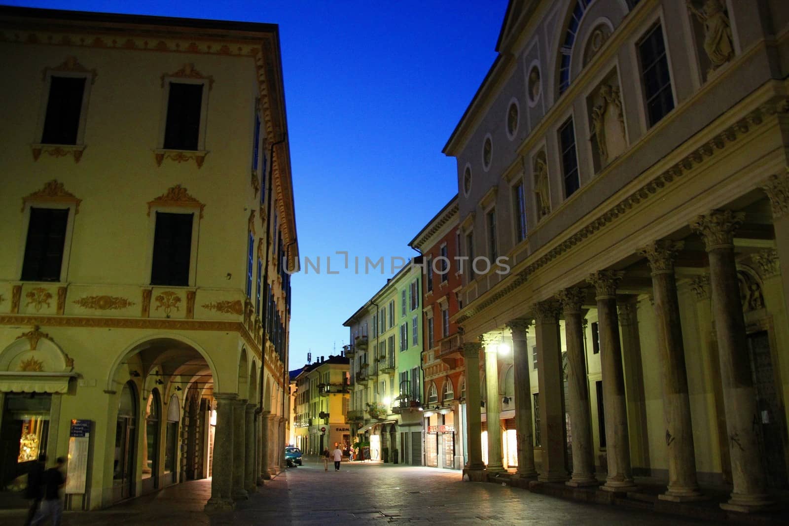 Quiet pedestrian streets at night in the village centre of Como, Italy