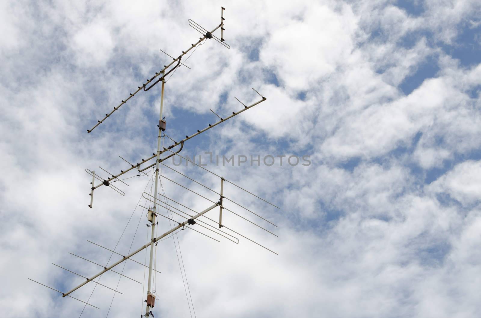 antenna tower under bright blue sky