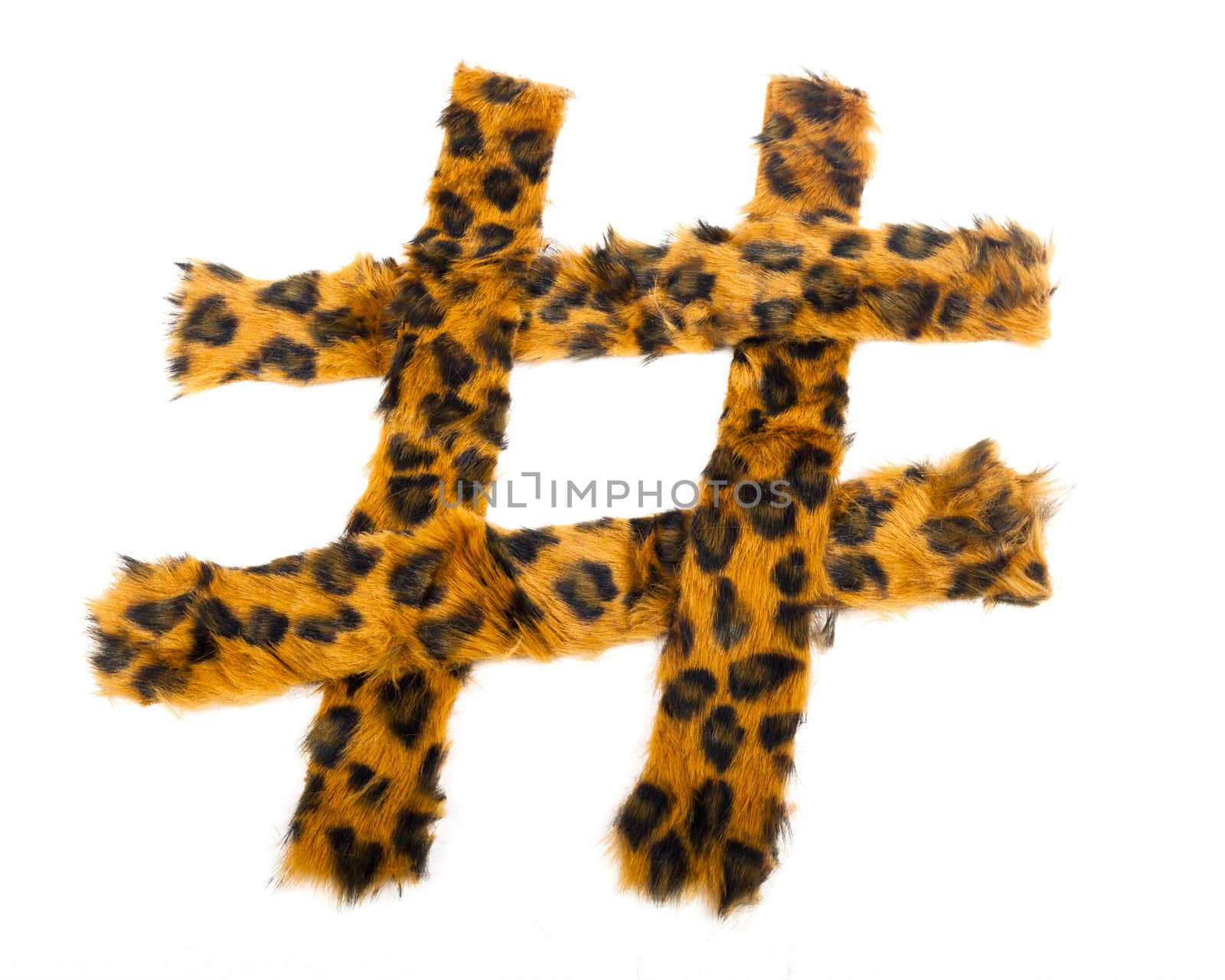 A hashtag made of leopard print fur against a white background.
