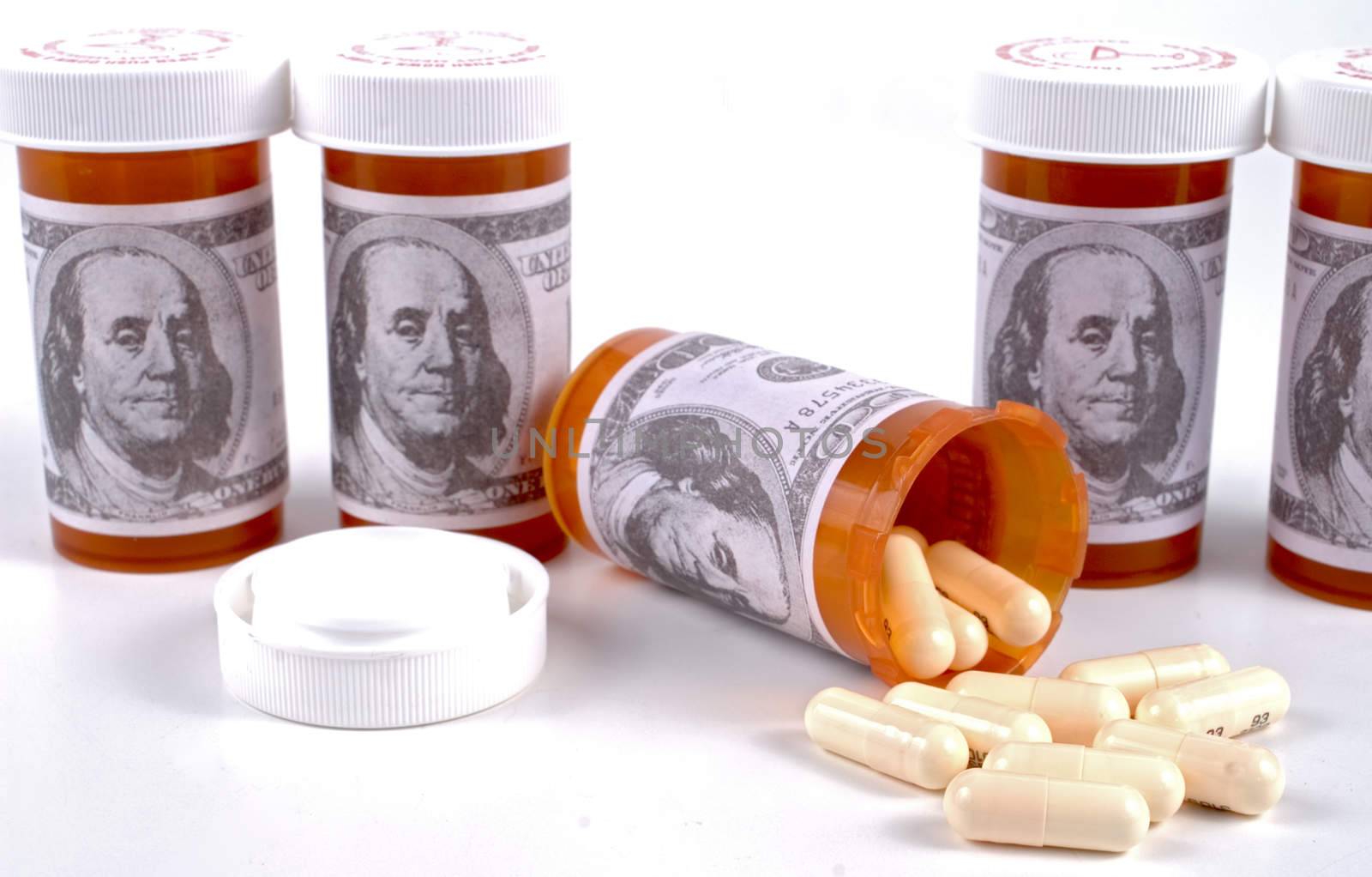 Prescription bottles with dollar bill labels and pills.