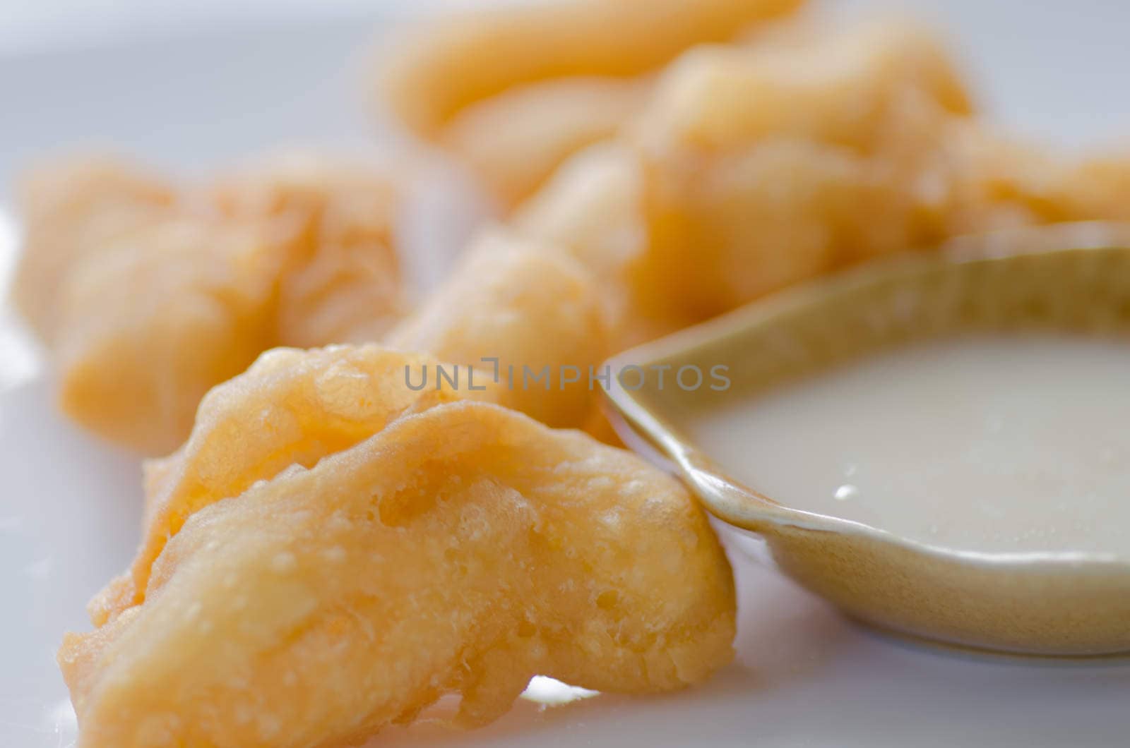 deep fried doughstick with sweetened condensed milk