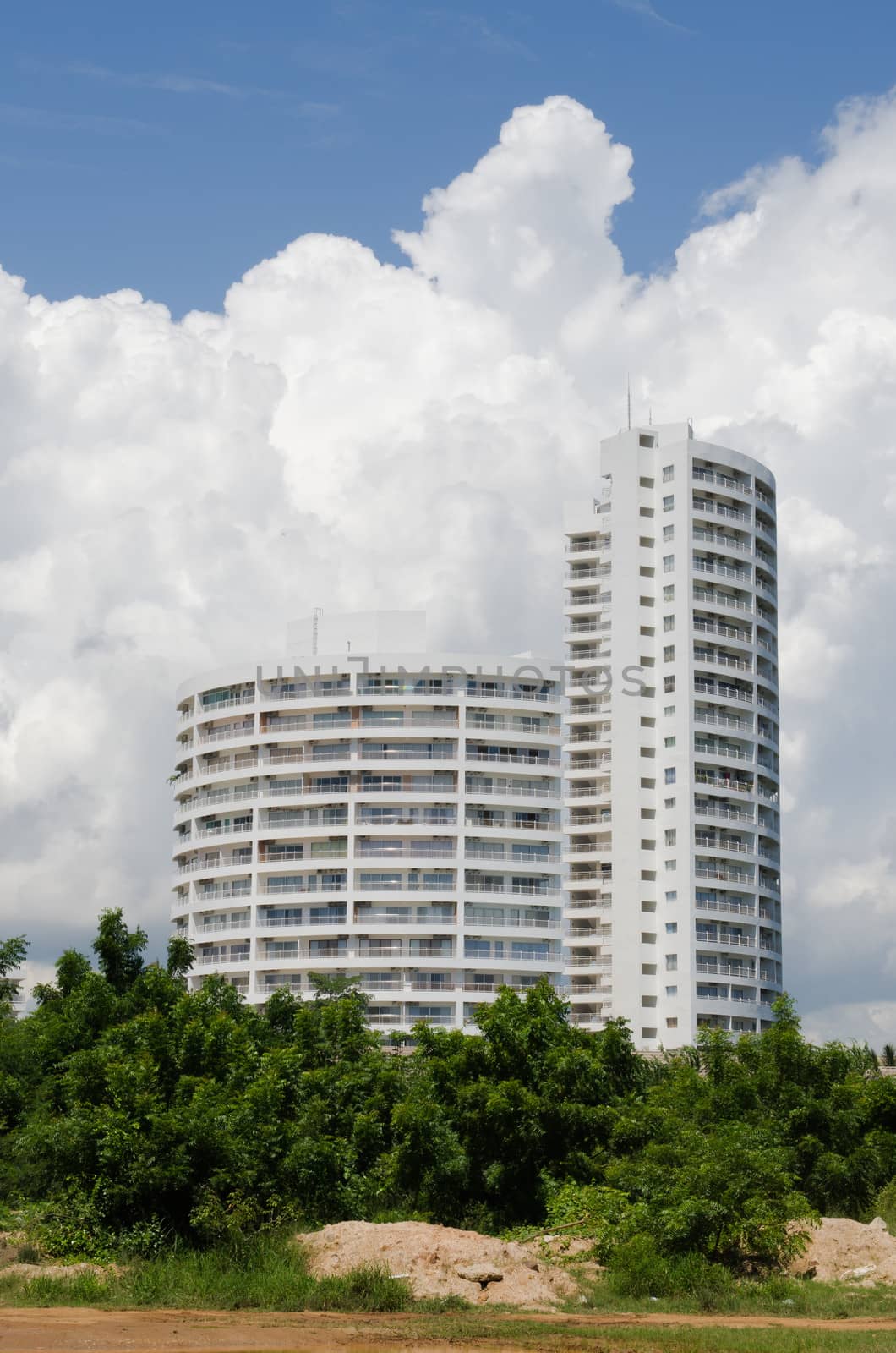 condominium buildings under the blue sky