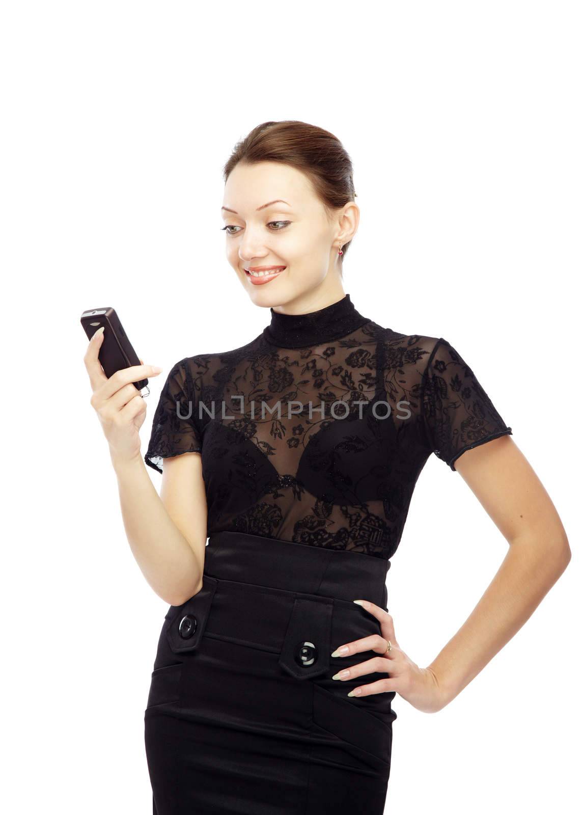 Smiling lady reading SMS on her cell phone on a white background