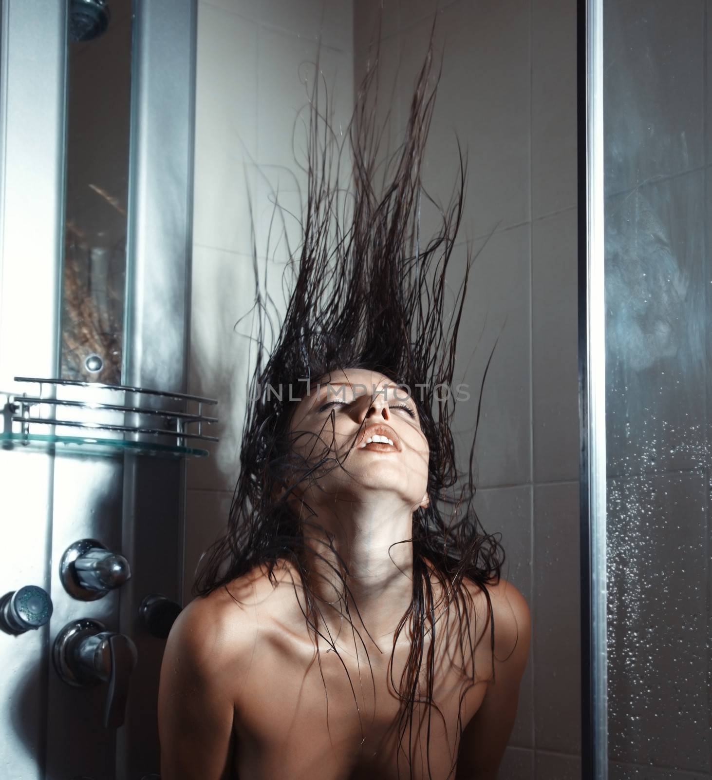 Woman in bathroom moving hairs