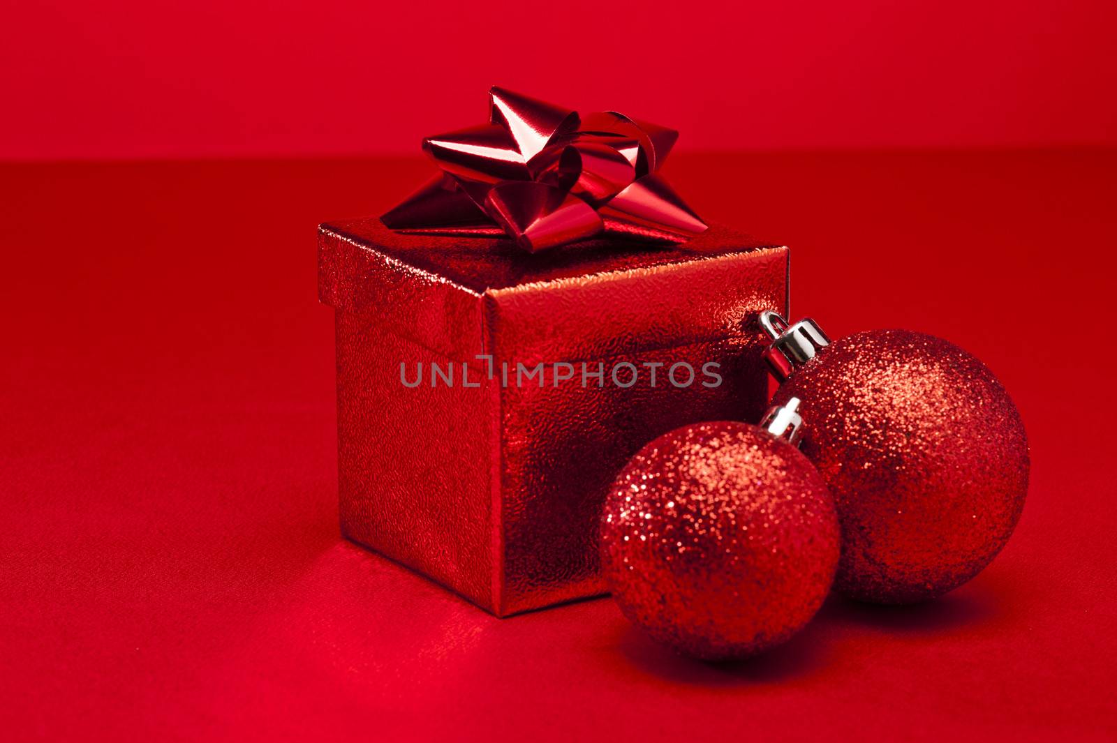 Red bauble and Christmas present  by 3523Studio