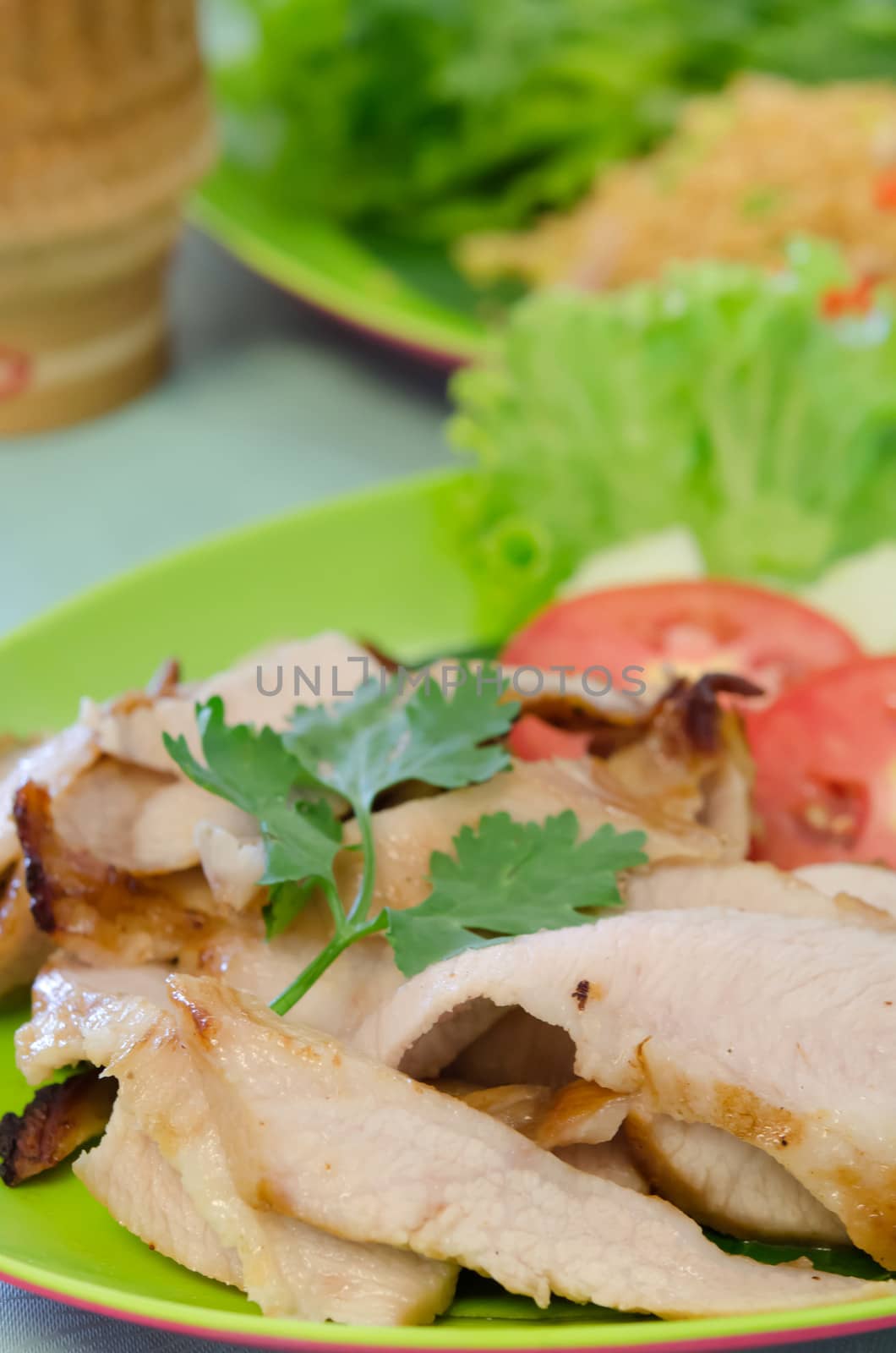 close up slice grilled pork  served with vegetable