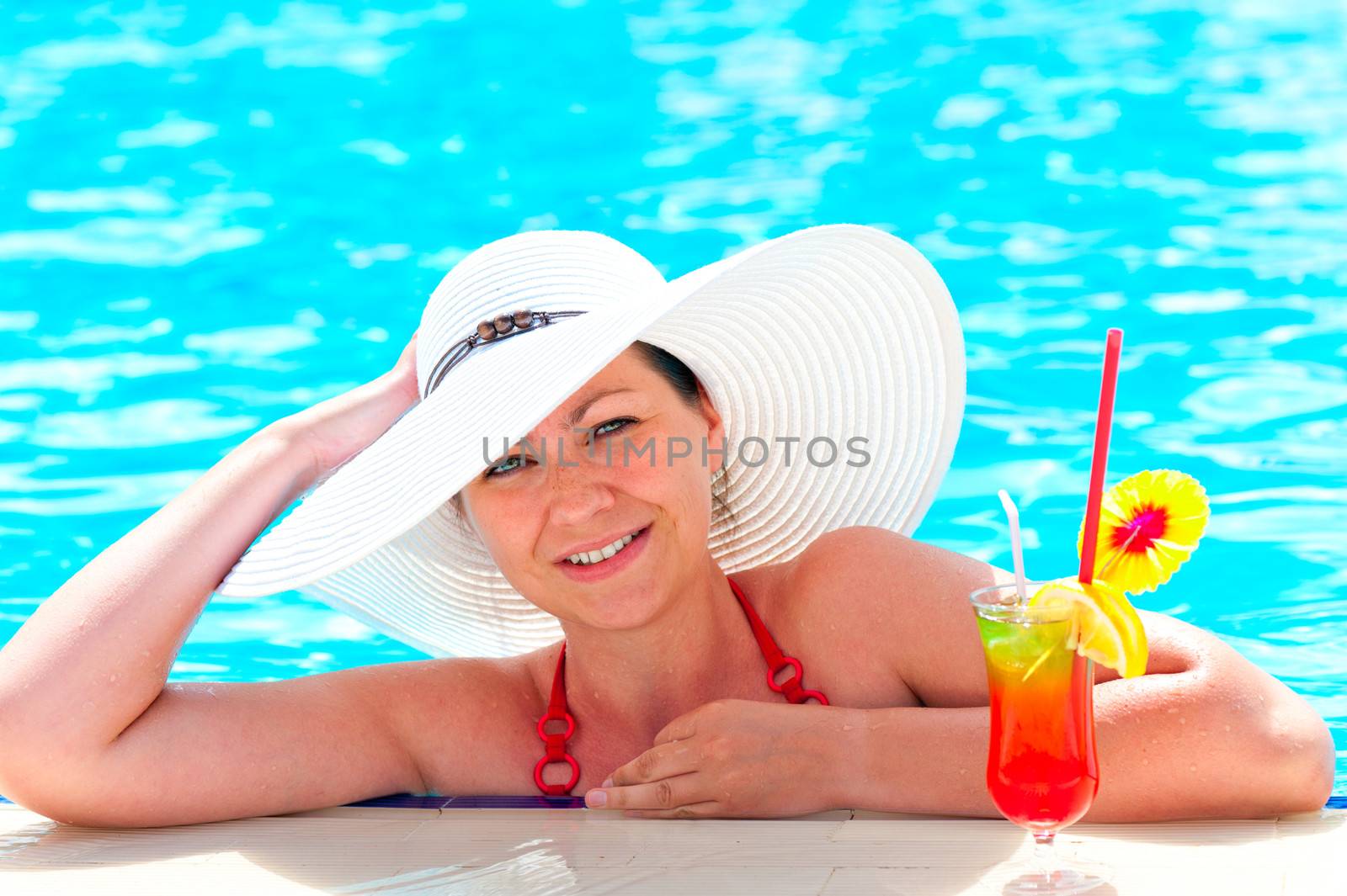 girl in a white hat relaxes in the pool by kosmsos111