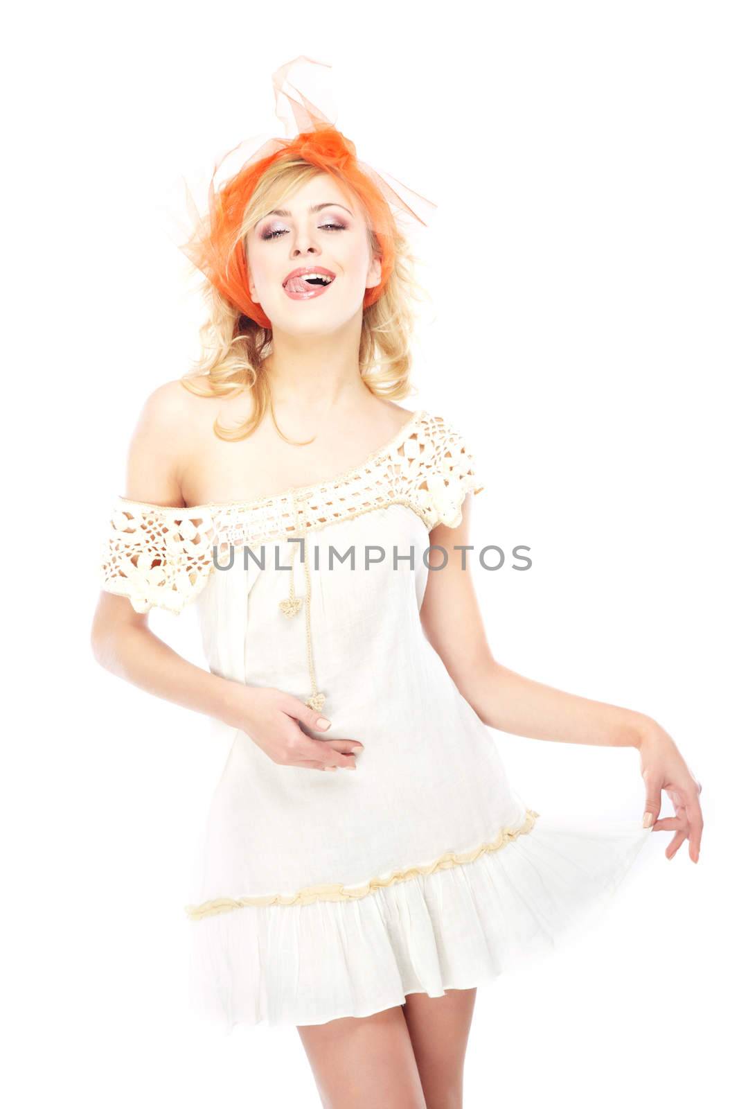 Playful smiling lady in white dress on a white background
