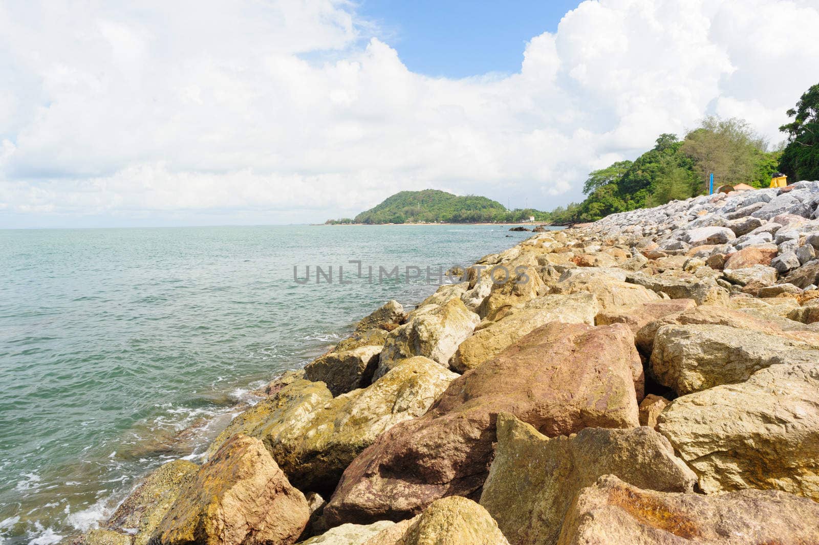 Stone wave barrier near beach in Chanthaburi, Thailand.