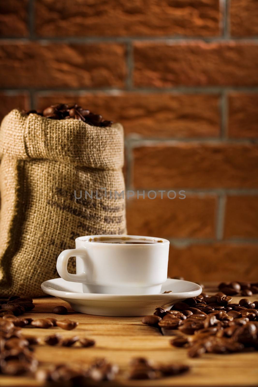cup and bag with beans of coffee