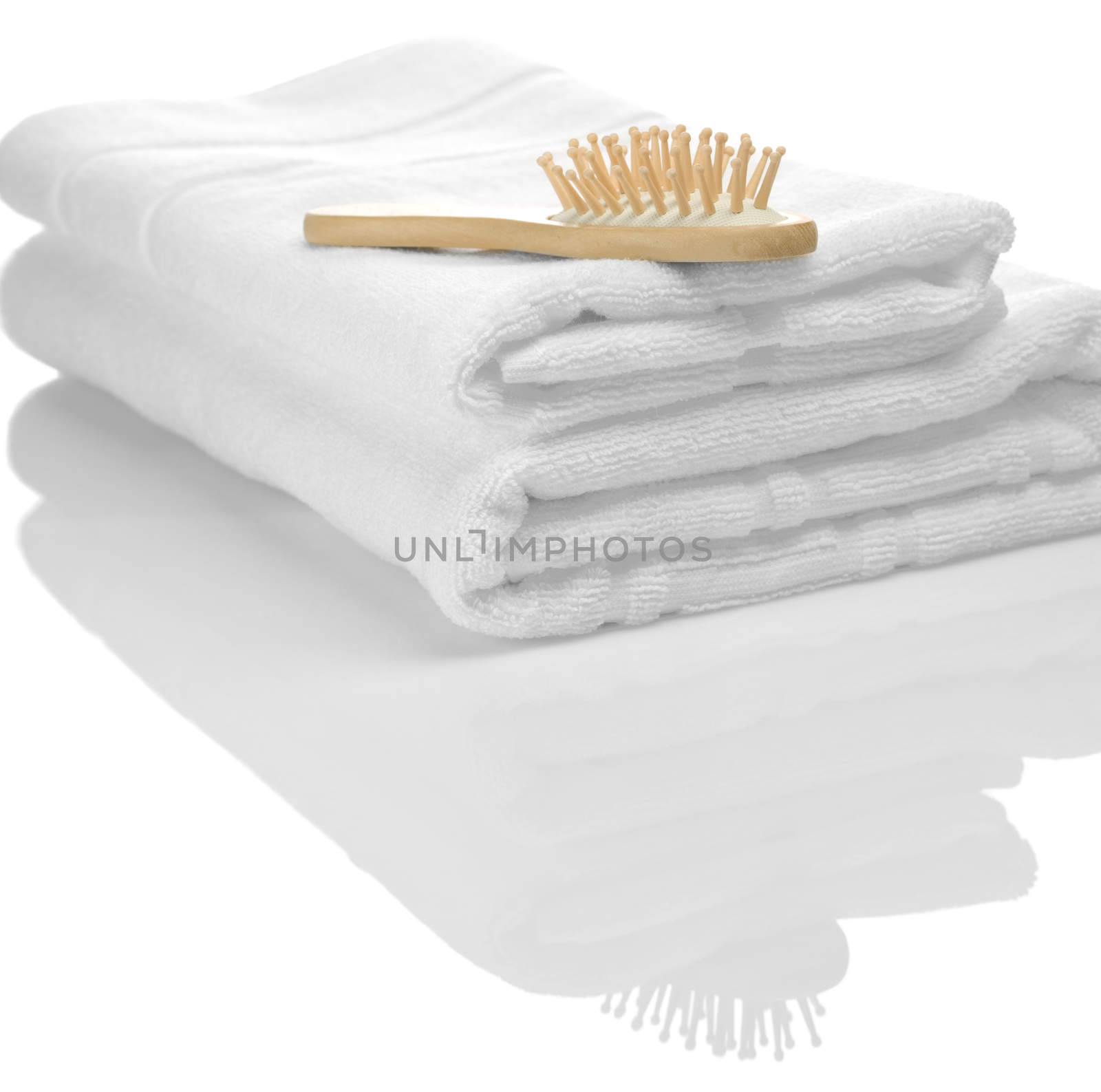 two towels and hairbrush