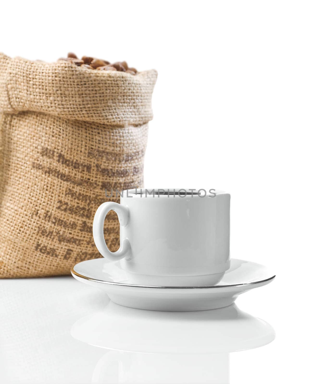 white cup and sack with beans