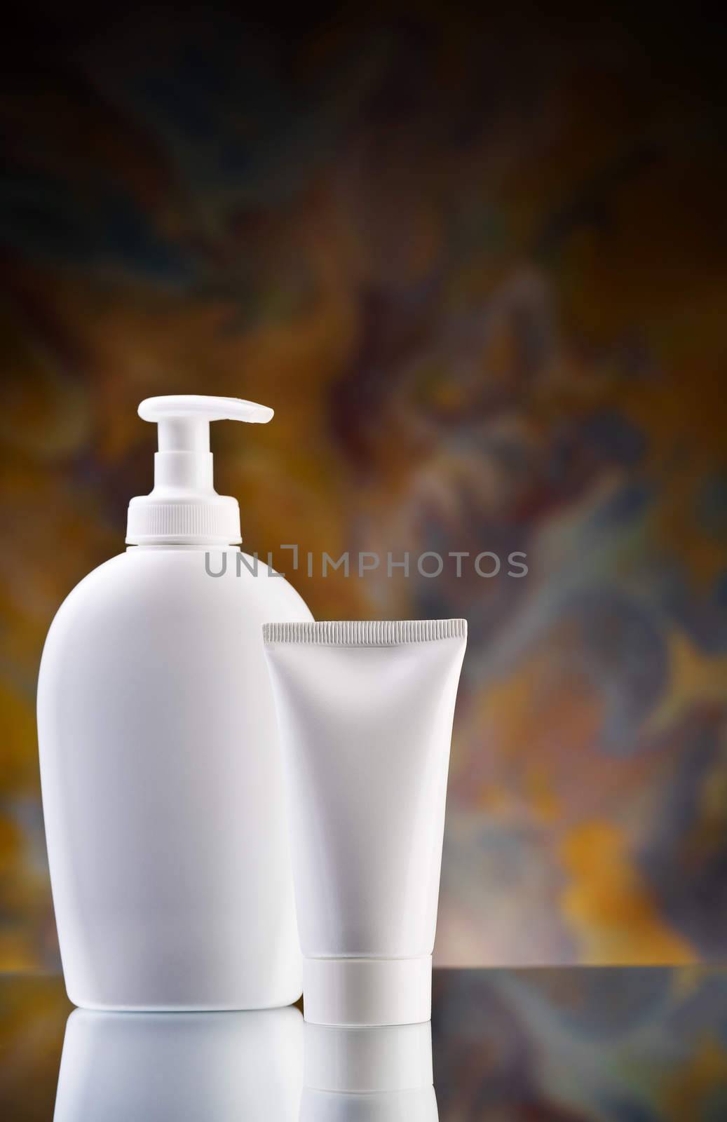 white tube and spray bottle