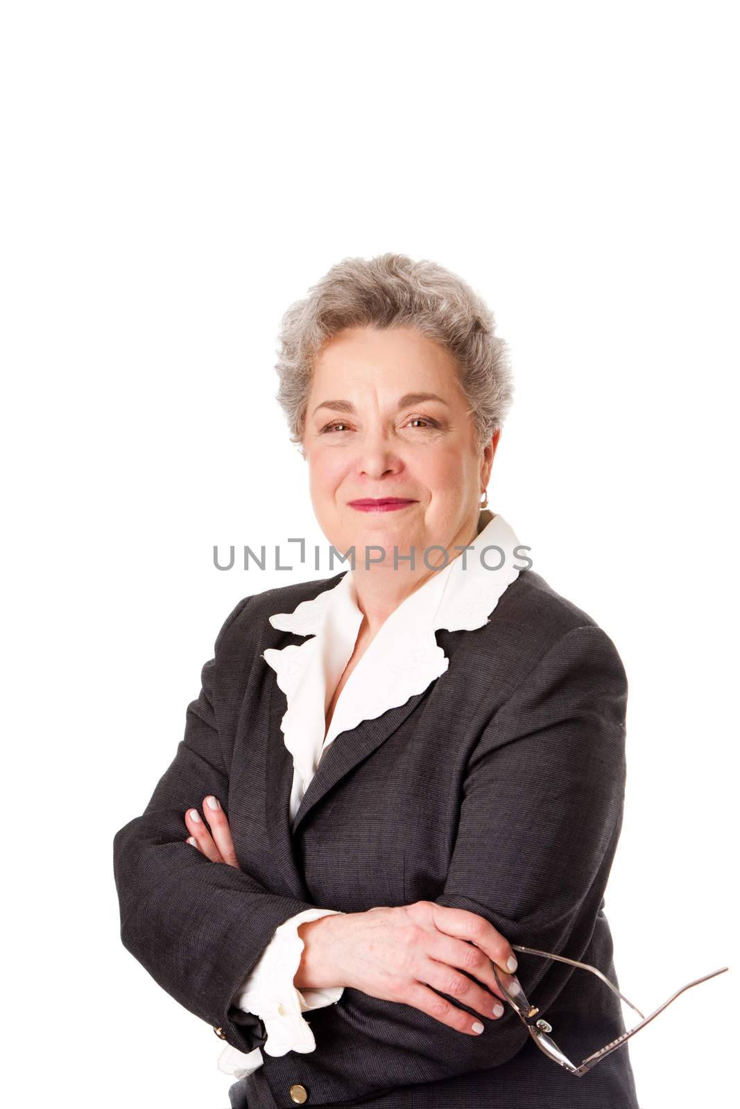 Happy smiling beautiful senior female corporate business lawyer director with arms crossed, isolated.