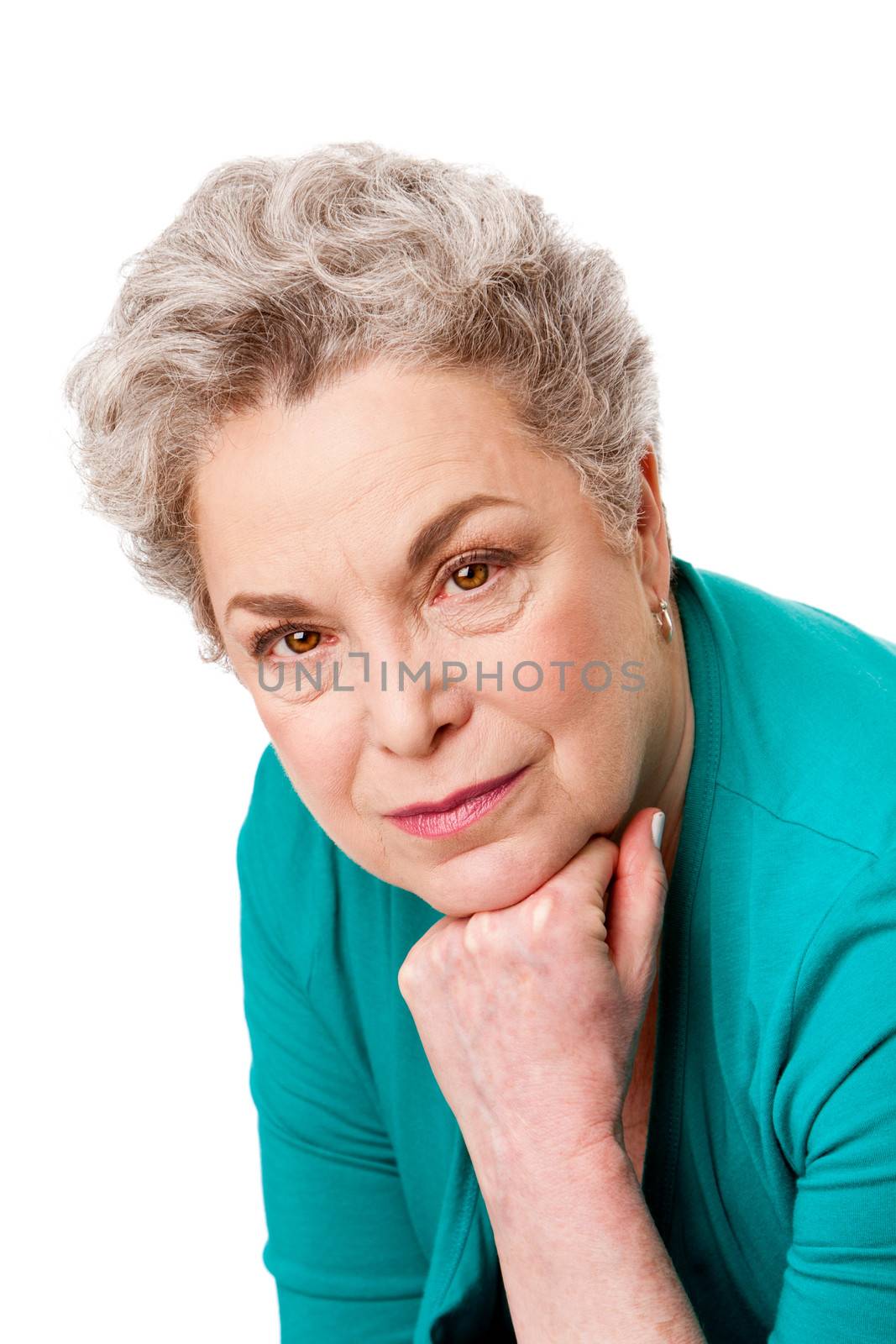 Portrait of a beautiful Senior old woman face with gray hair and hand under her chin, isolated.