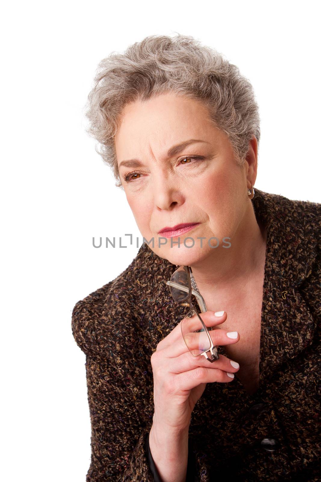 Beautiful senior woman with gray hair thinking about future holding glasses, isolated.