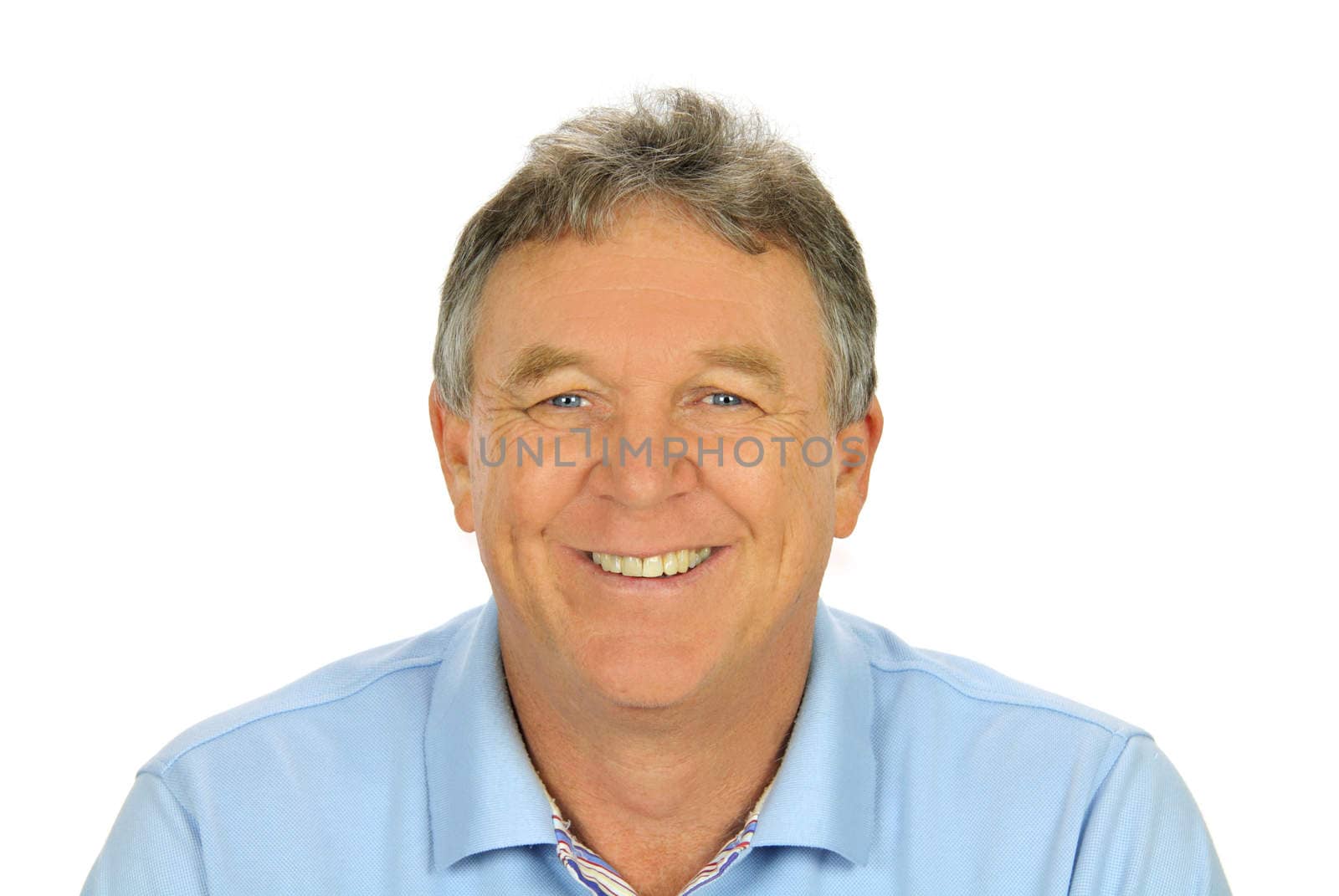 Close up of middle aged casual man smiling and sitting.