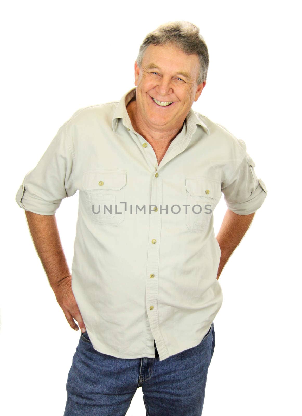 Casual middle aged man standing and smiling.