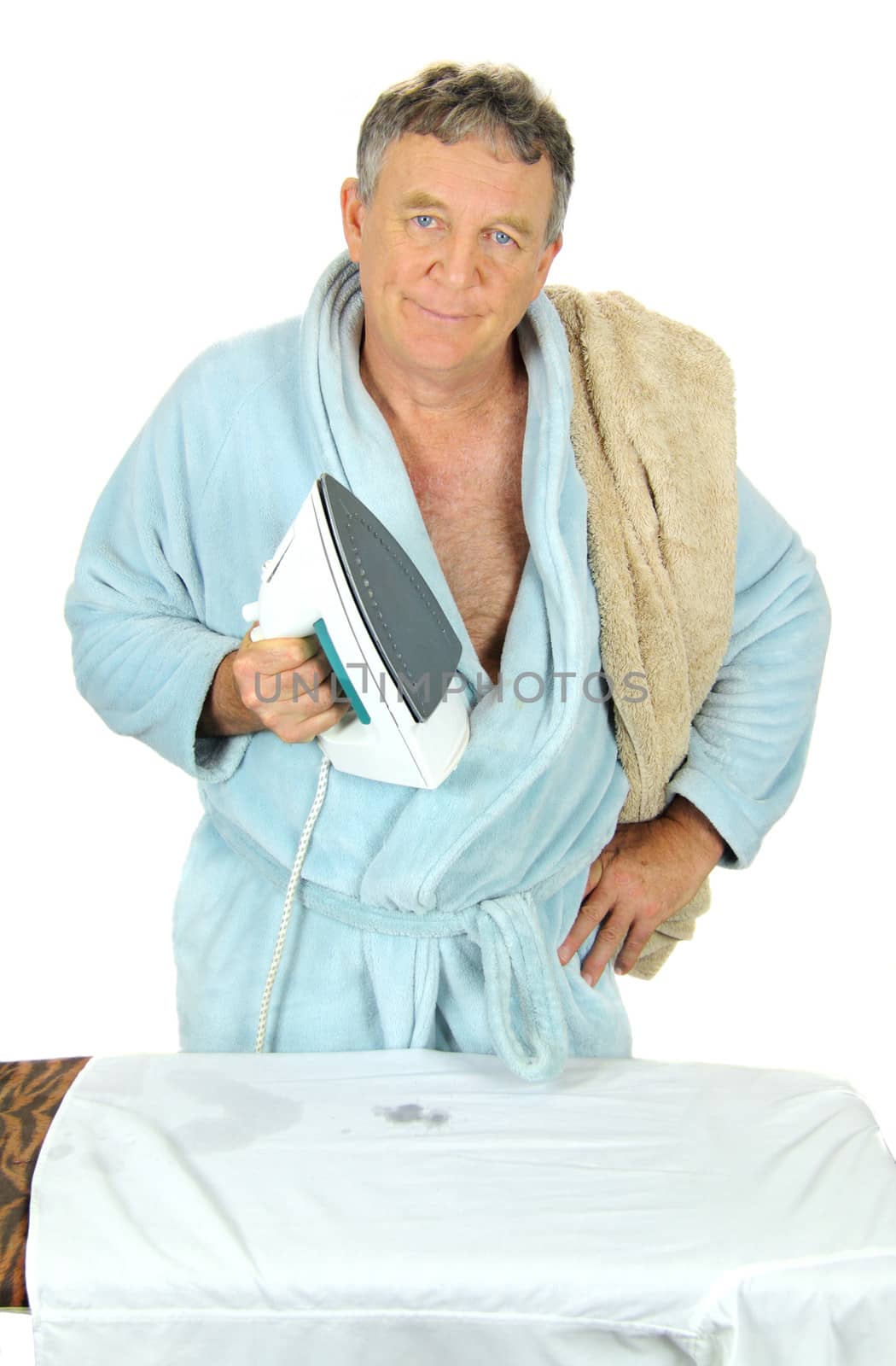 Grumpy middle aged man ironing his shirt.