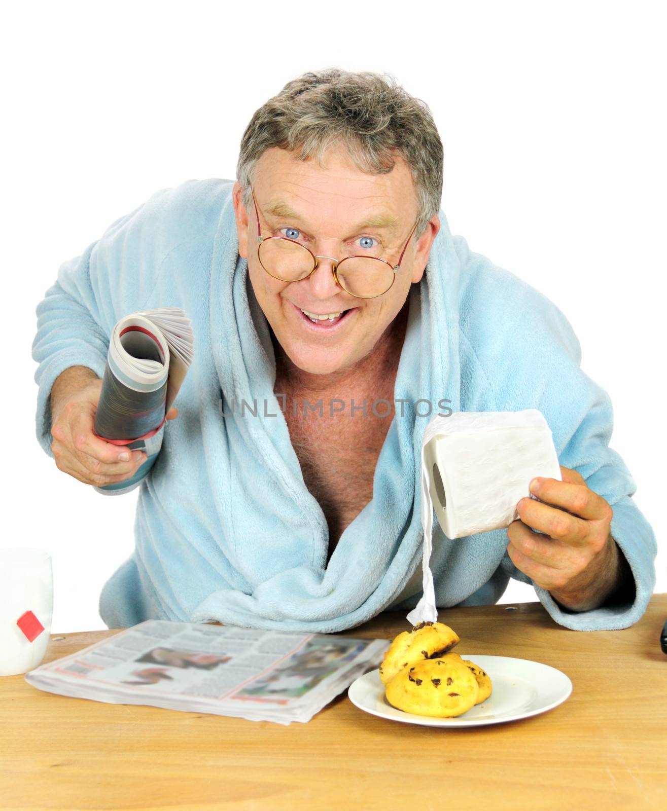 Man at the breakfast table with a toilet roll and a sense of urgency.