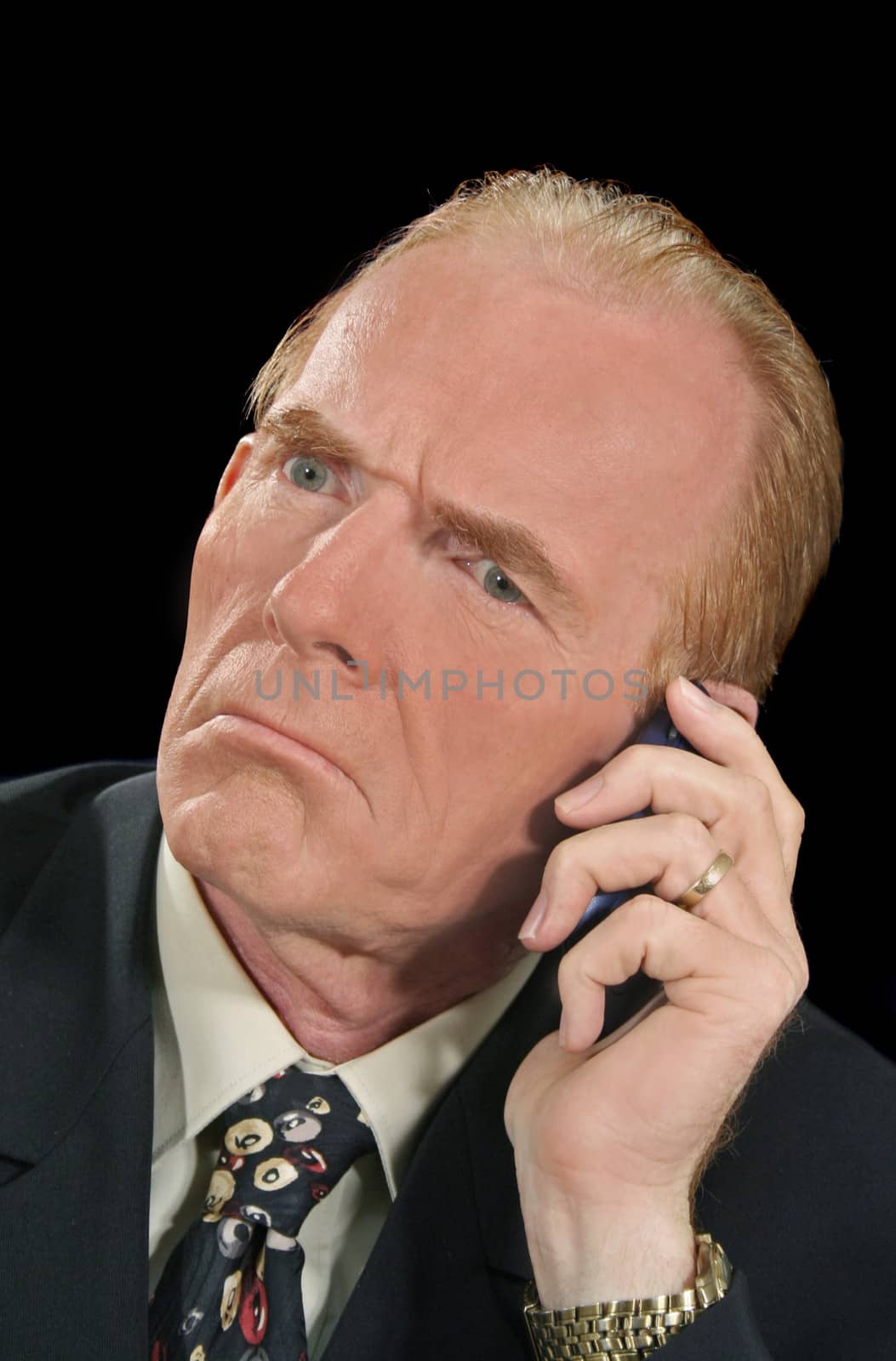 Perplexed businessman takes a confusing phone call.