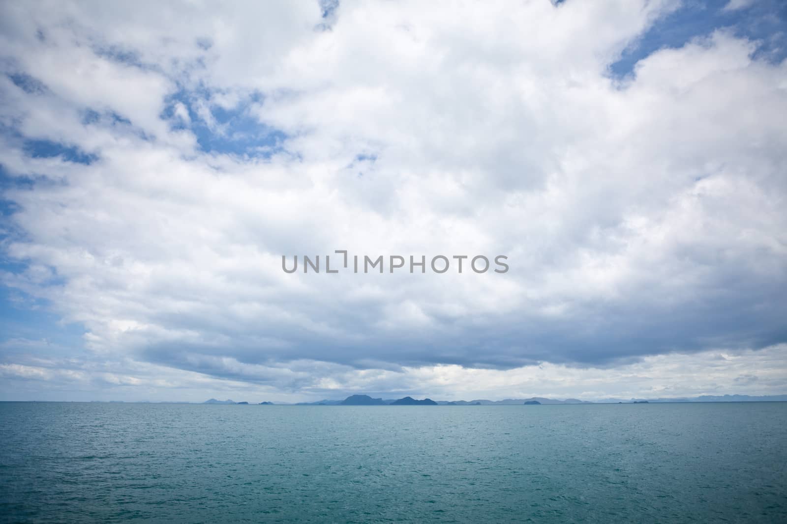 dark cloudy stormy sky with clouds and waves in the sea