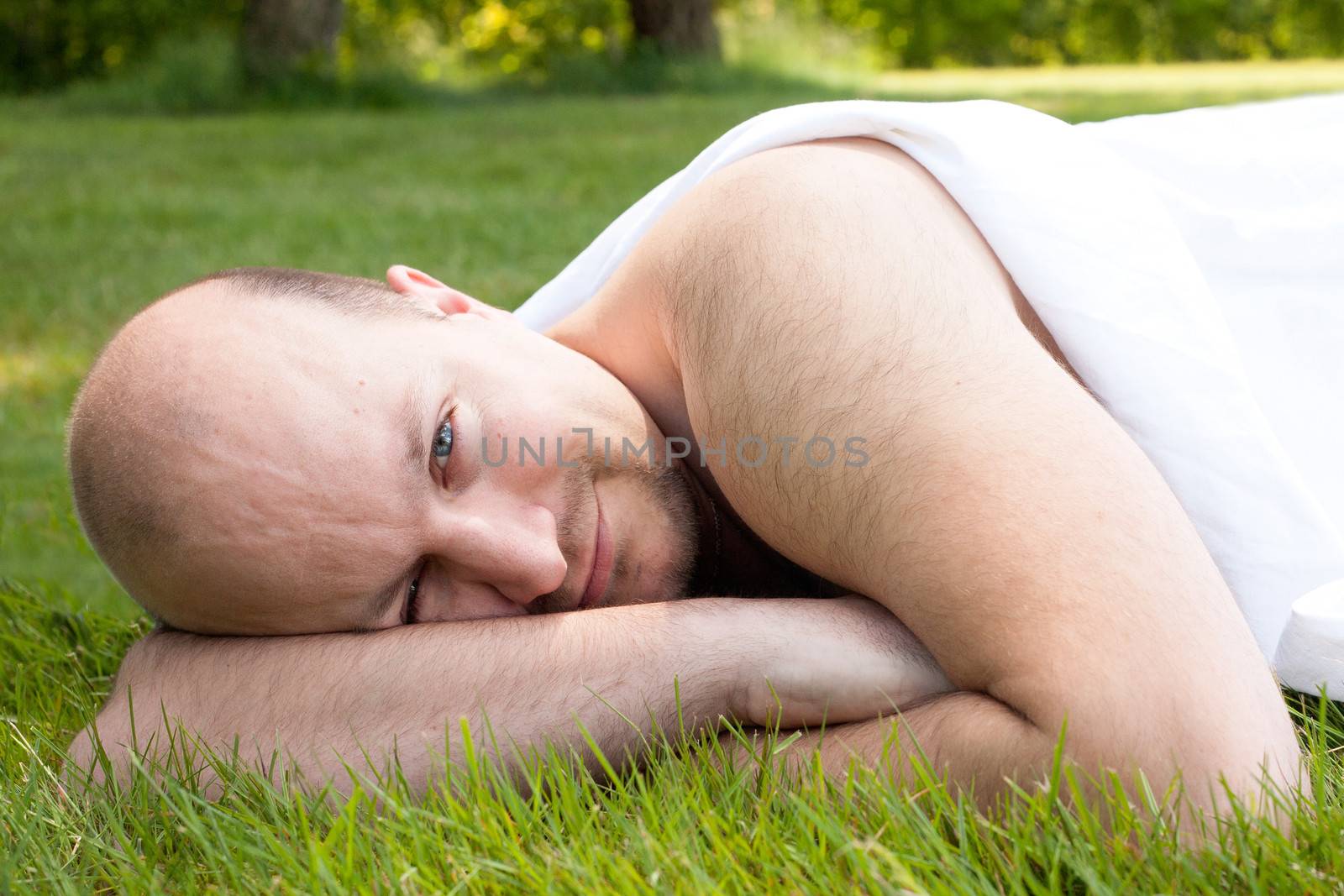 Happy young couple dressed white in the nature