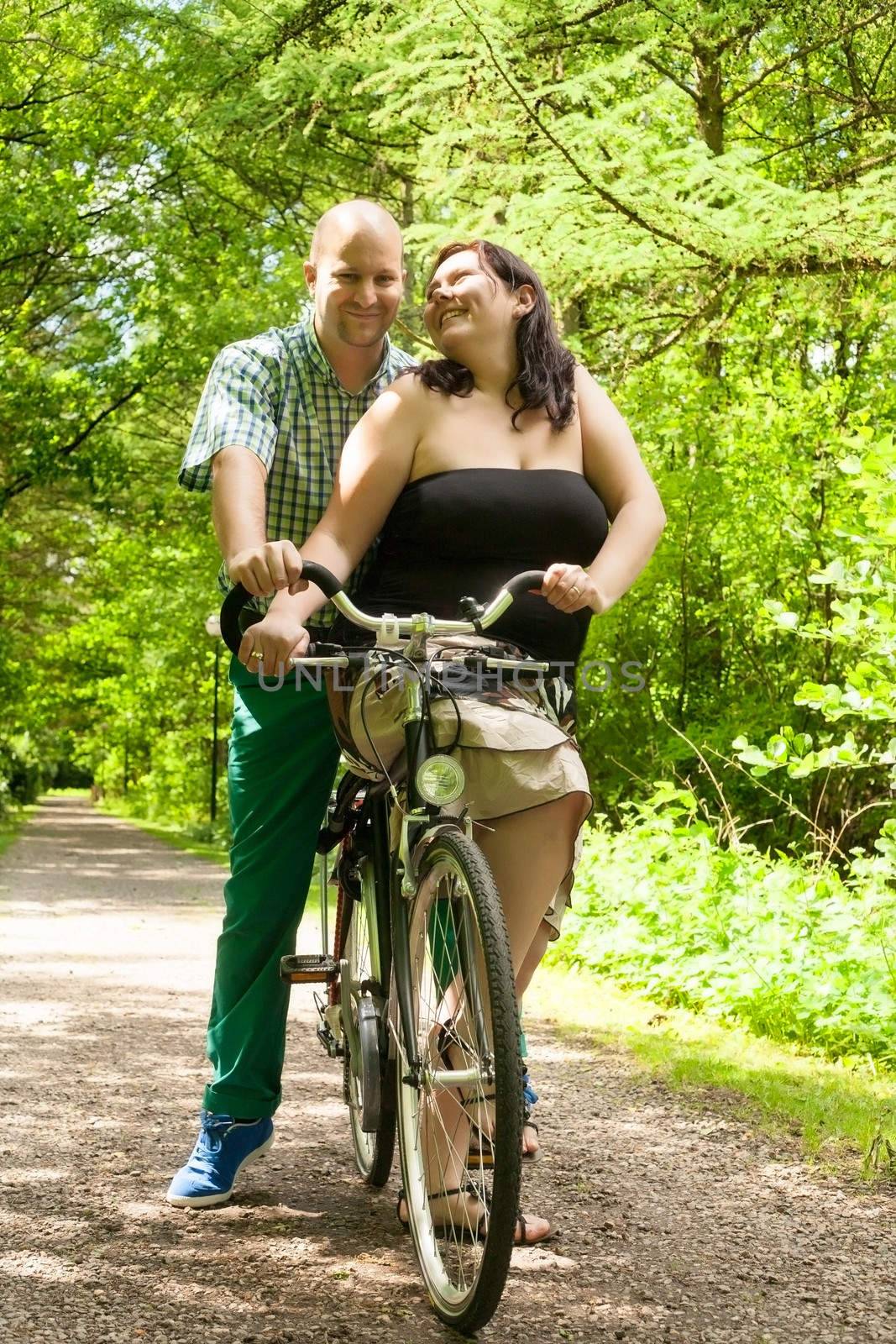 romnantic couple on a bike by DNFStyle