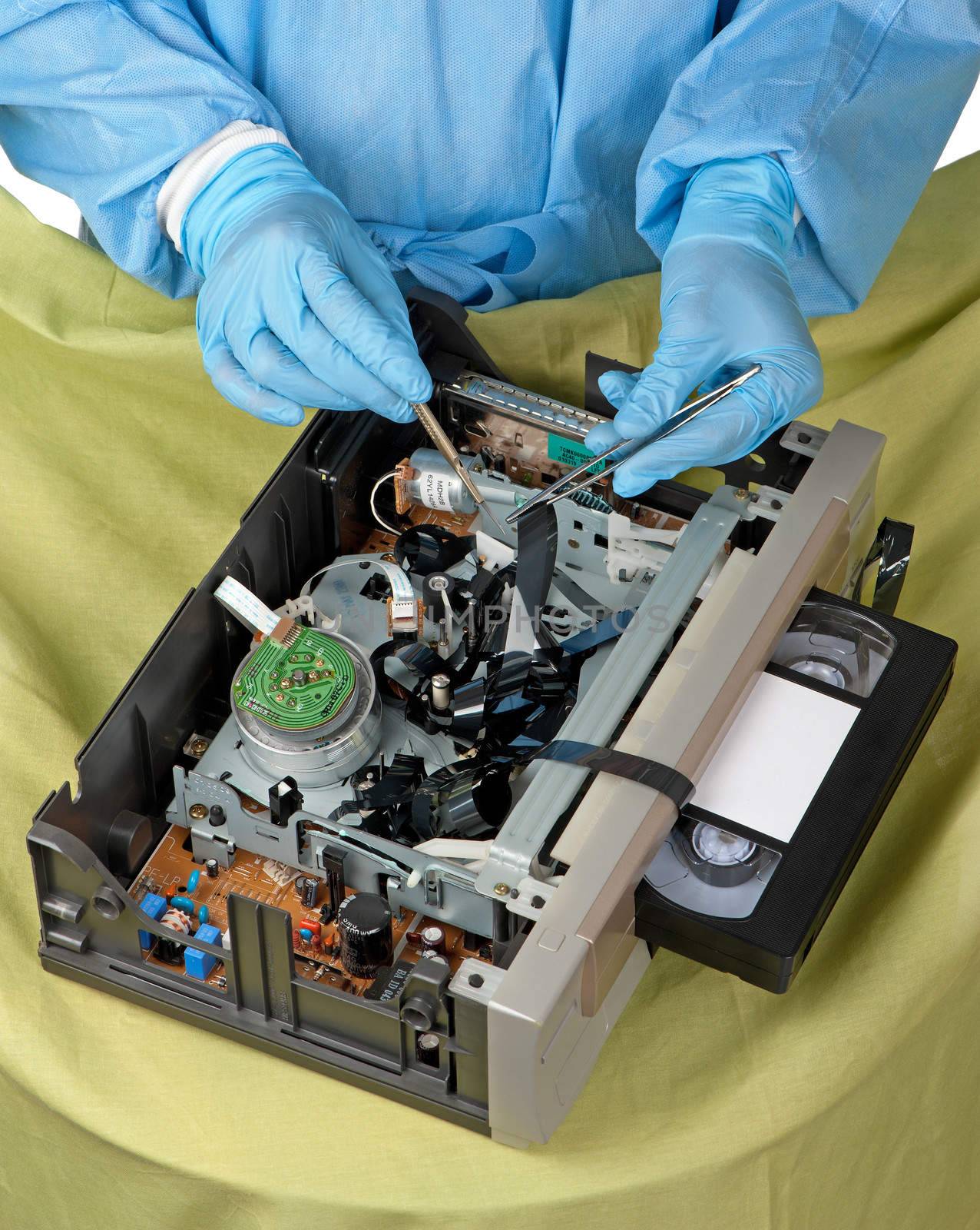 A surgeon tries to revive old technology in the shape of a tangled VHS cassette tape.