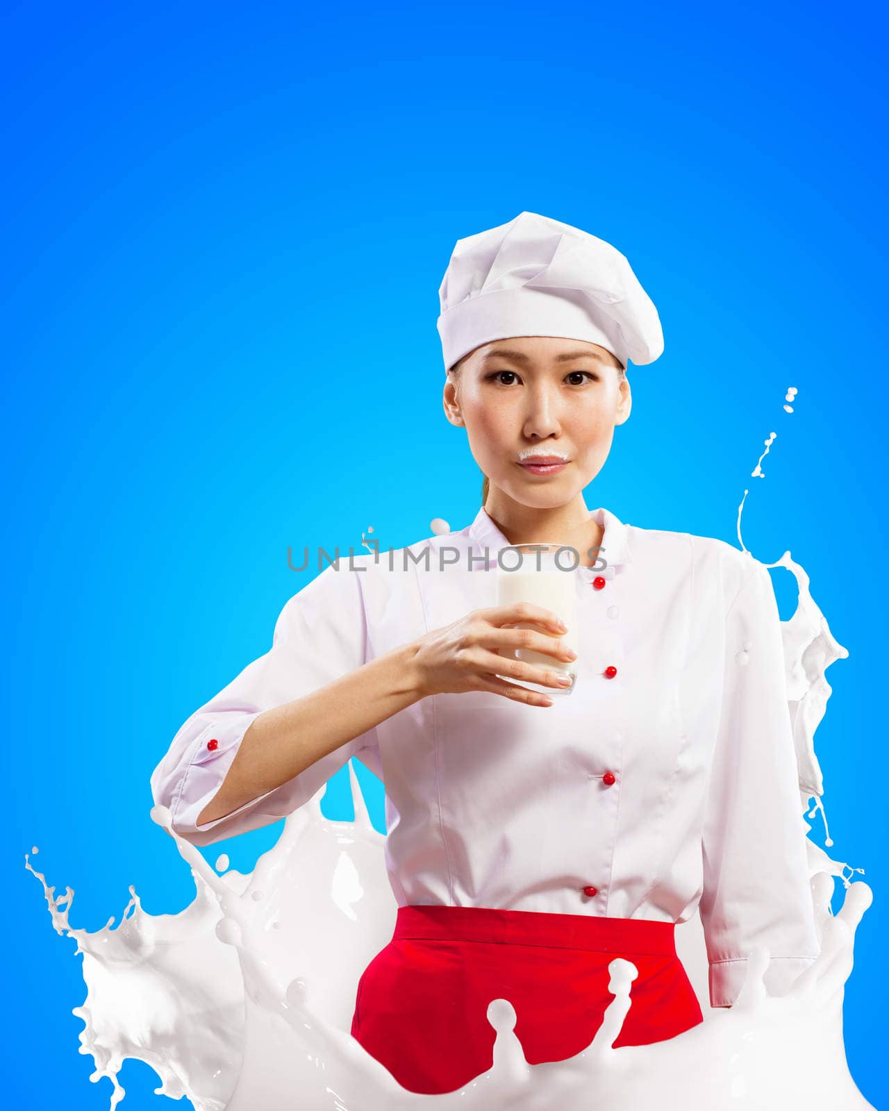 Asian female cook against milk splashes by sergey_nivens