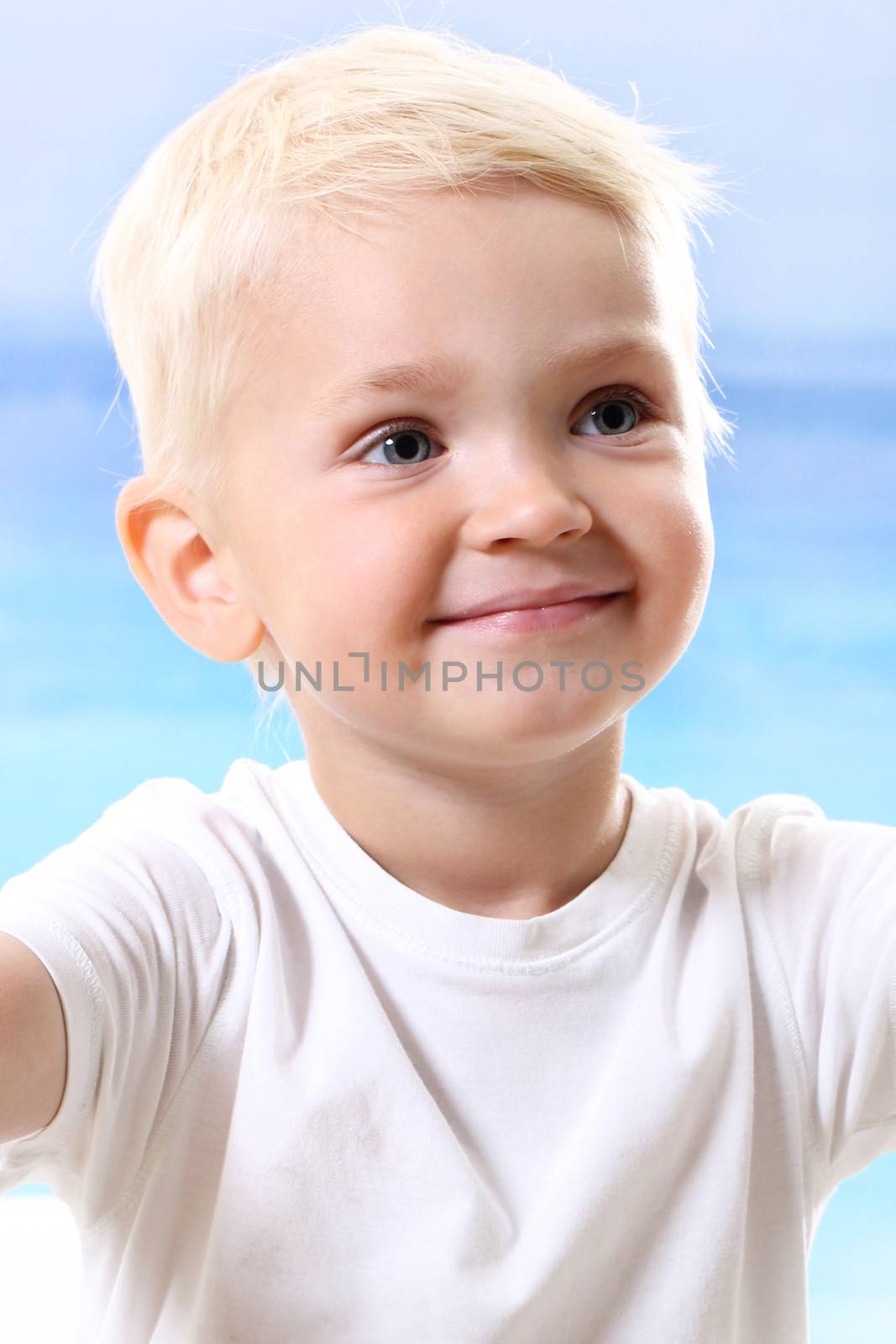 Beautiful little boy on the beach by robert_przybysz