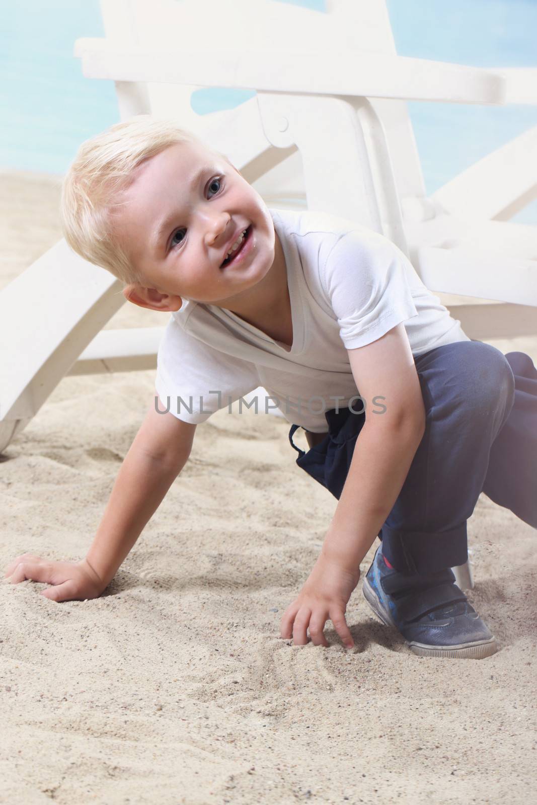 Beautiful little boy on the beach