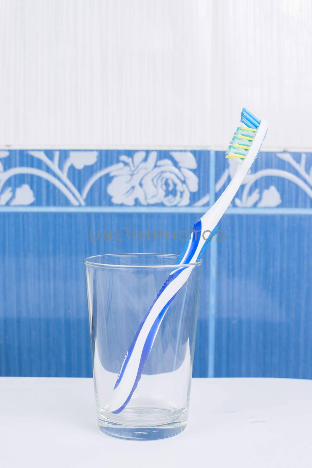 Toothbrush in glass in the bathroom. High resolution