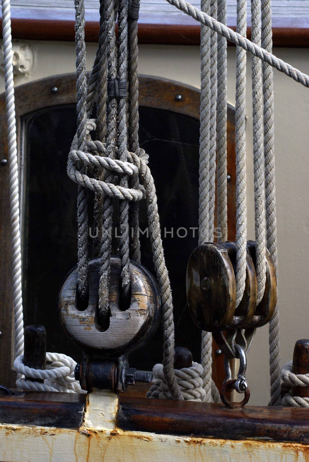 A photo showing the details of a ships rope pulleys.