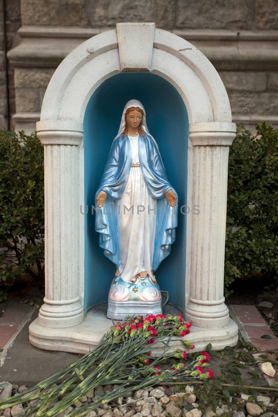 Sculpture of Virgin Mary near the temple.