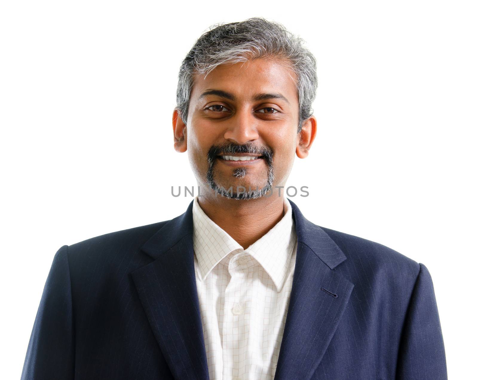 Good looking mature Asian Indian businessman with business suit smiling isolated on white background. Portrait of handsome Indian male model.