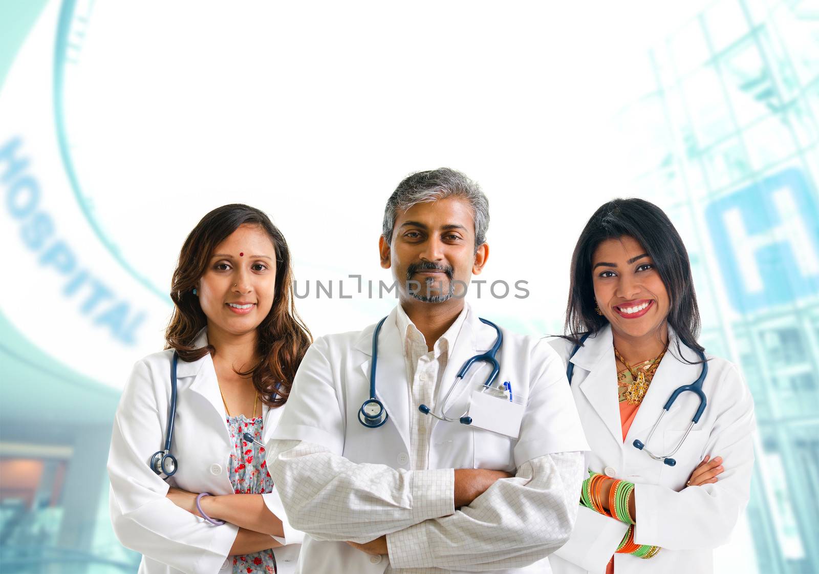 Indian doctors. Group of Indian medical doctors, male and female standing inside hospital.